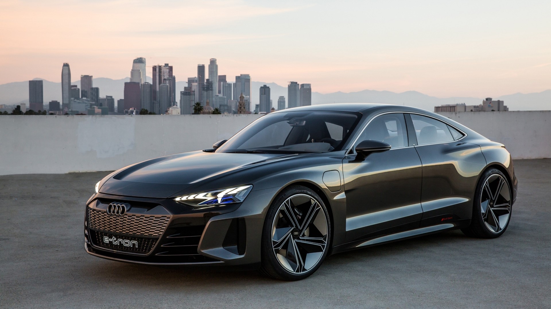 Audi E-Tron concept car in front of Los Angeles skyline HD Wallpaper