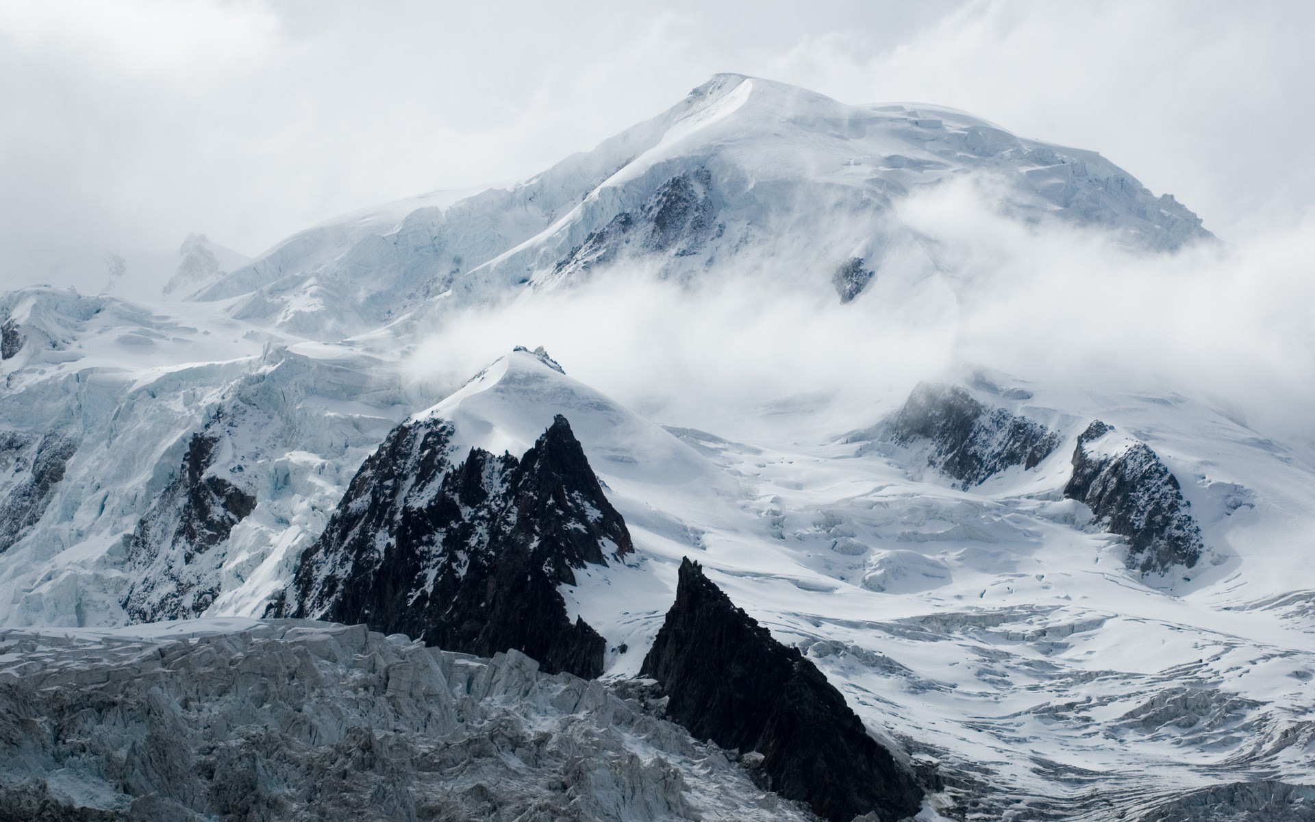 Snow-covered mountains with glaciers and clouds HD Wallpaper