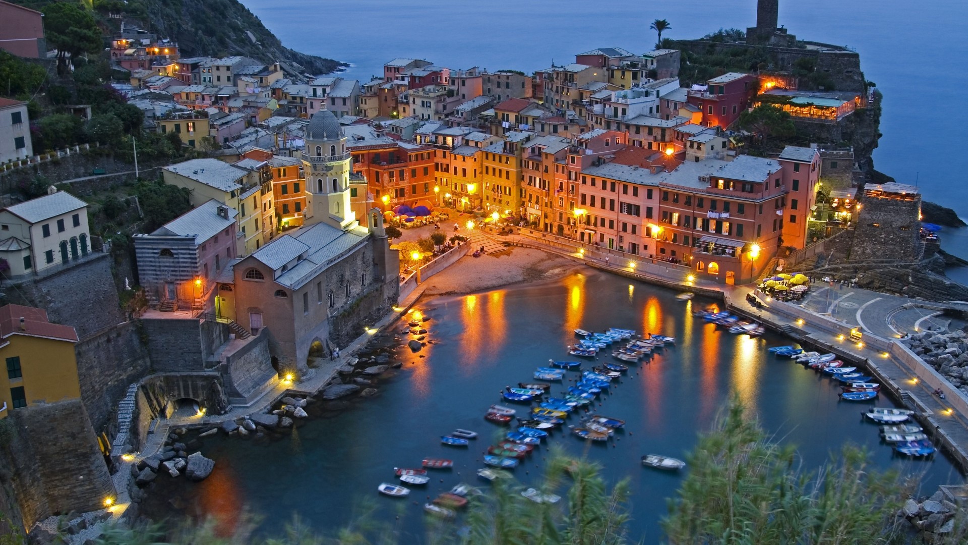 Vernazza, Italy harbor at dusk with boats and buildings HD Wallpaper