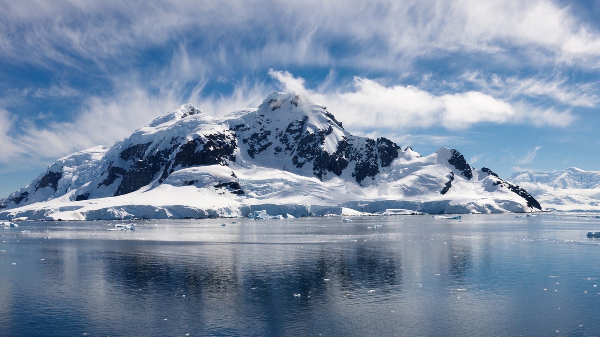 Snowy mountains reflected in the ocean HD Wallpaper