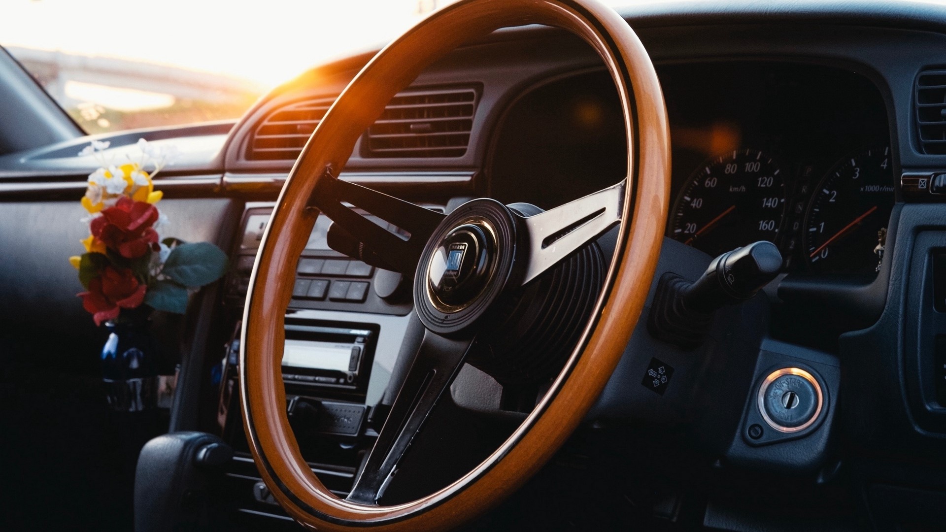 Car interior with wooden steering wheel and dashboard HD Wallpaper