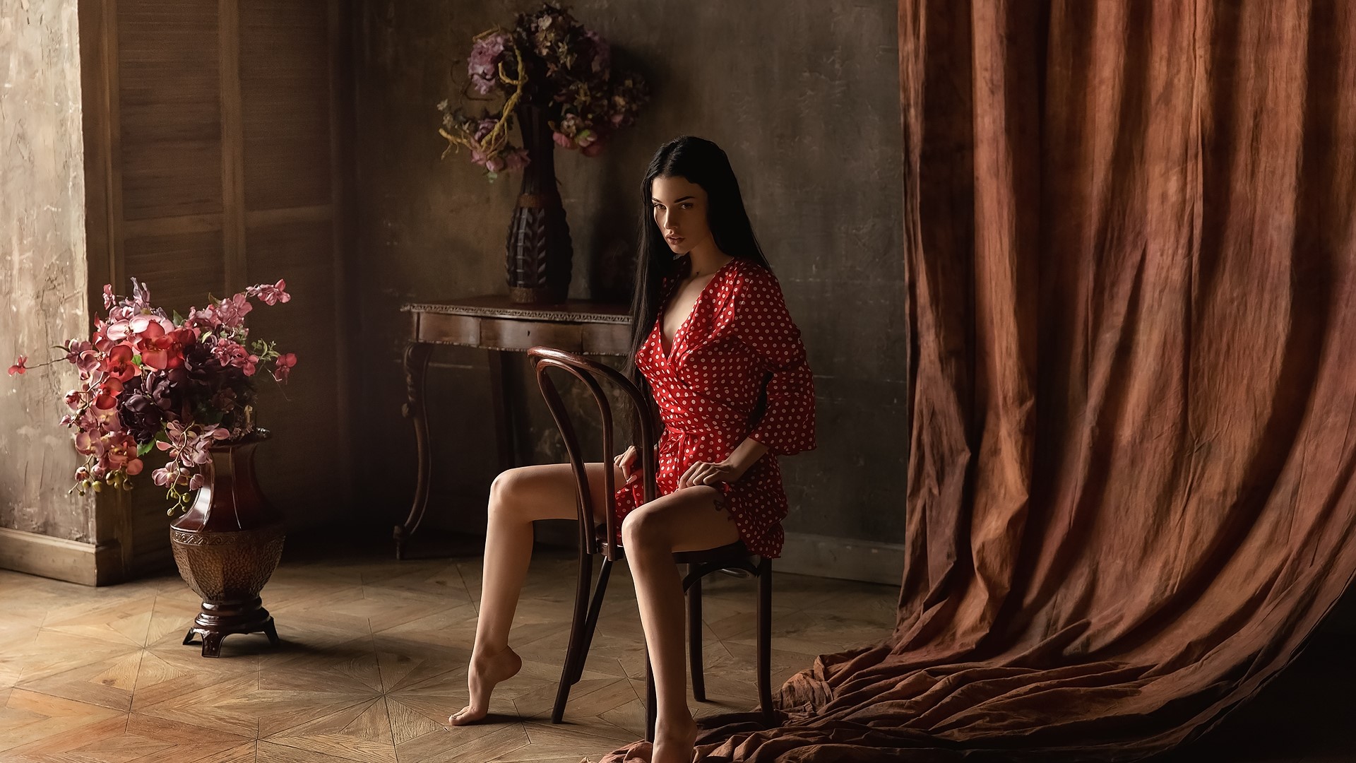 Model in a red polka dot dress sitting on a chair HD Wallpaper
