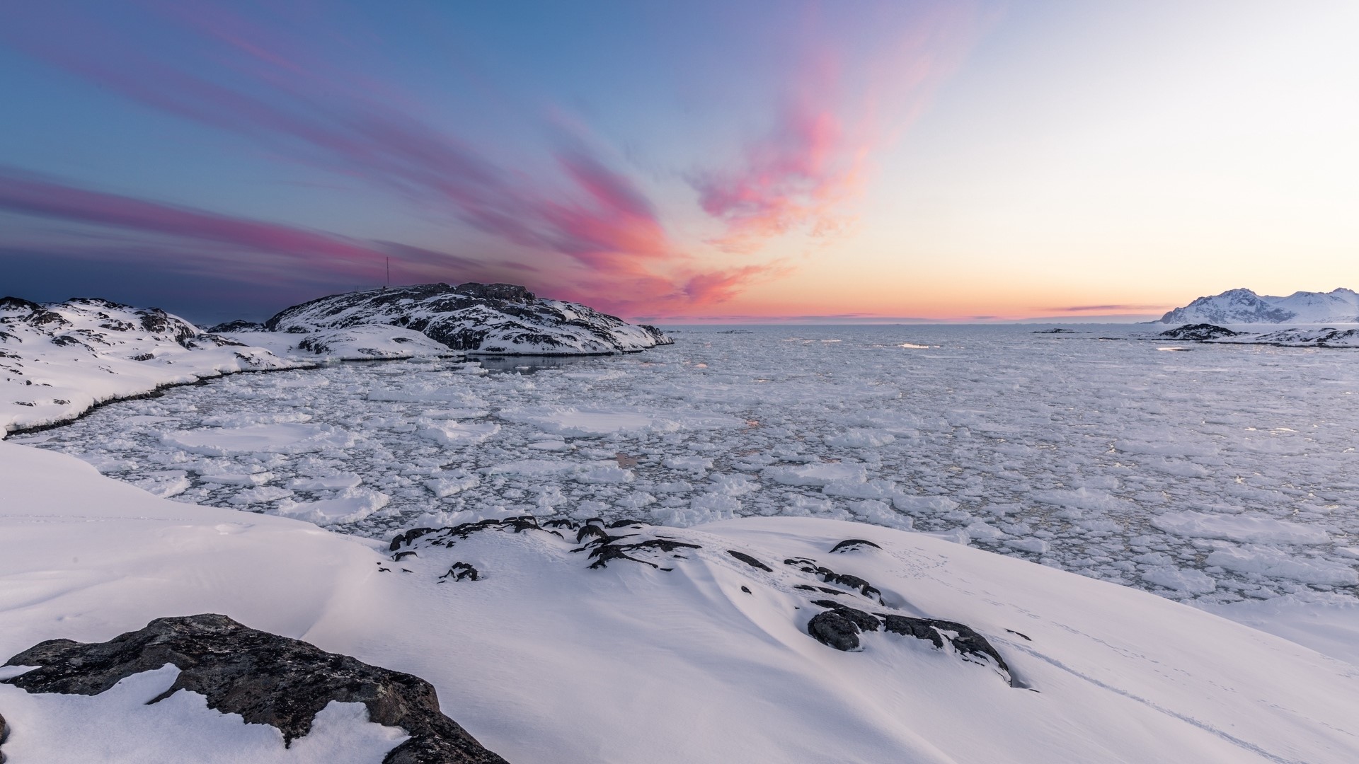 Ice floes in a bay at sunset with pink clouds HD Wallpaper