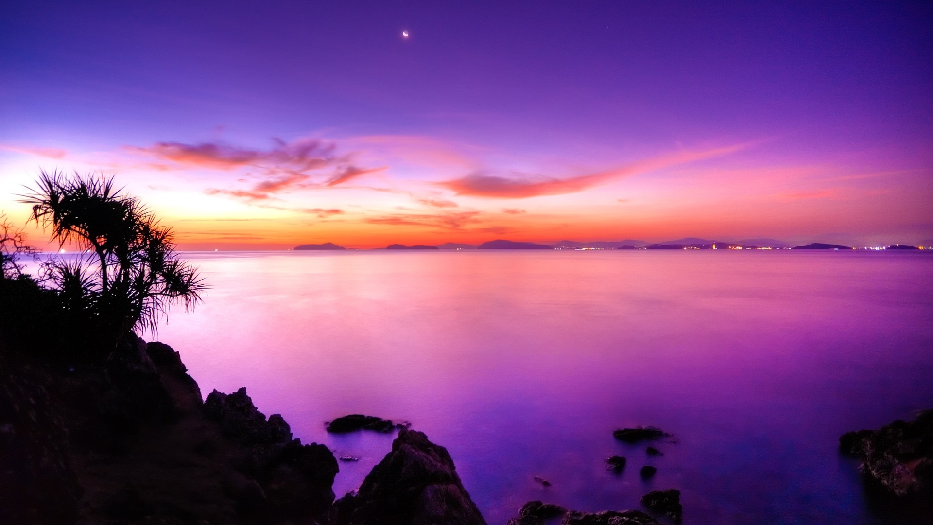 Purple and pink sunset over the ocean with islands HD Wallpaper