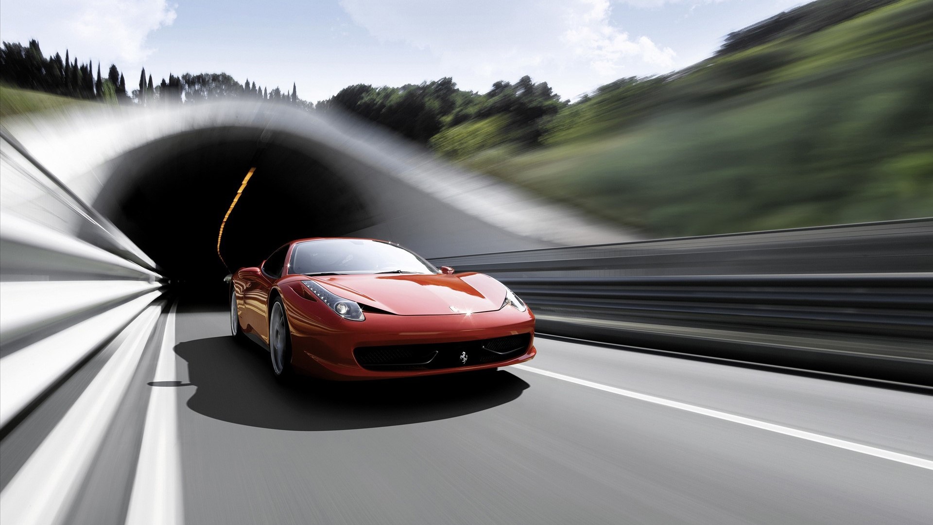Red Ferrari driving out of a tunnel HD Wallpaper