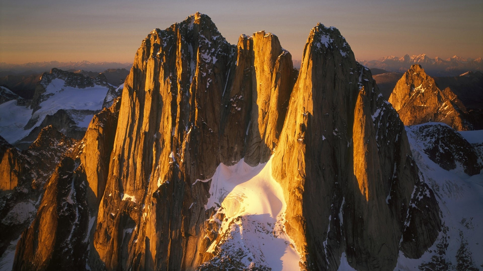 Jagged mountain peaks at sunset HD Wallpaper