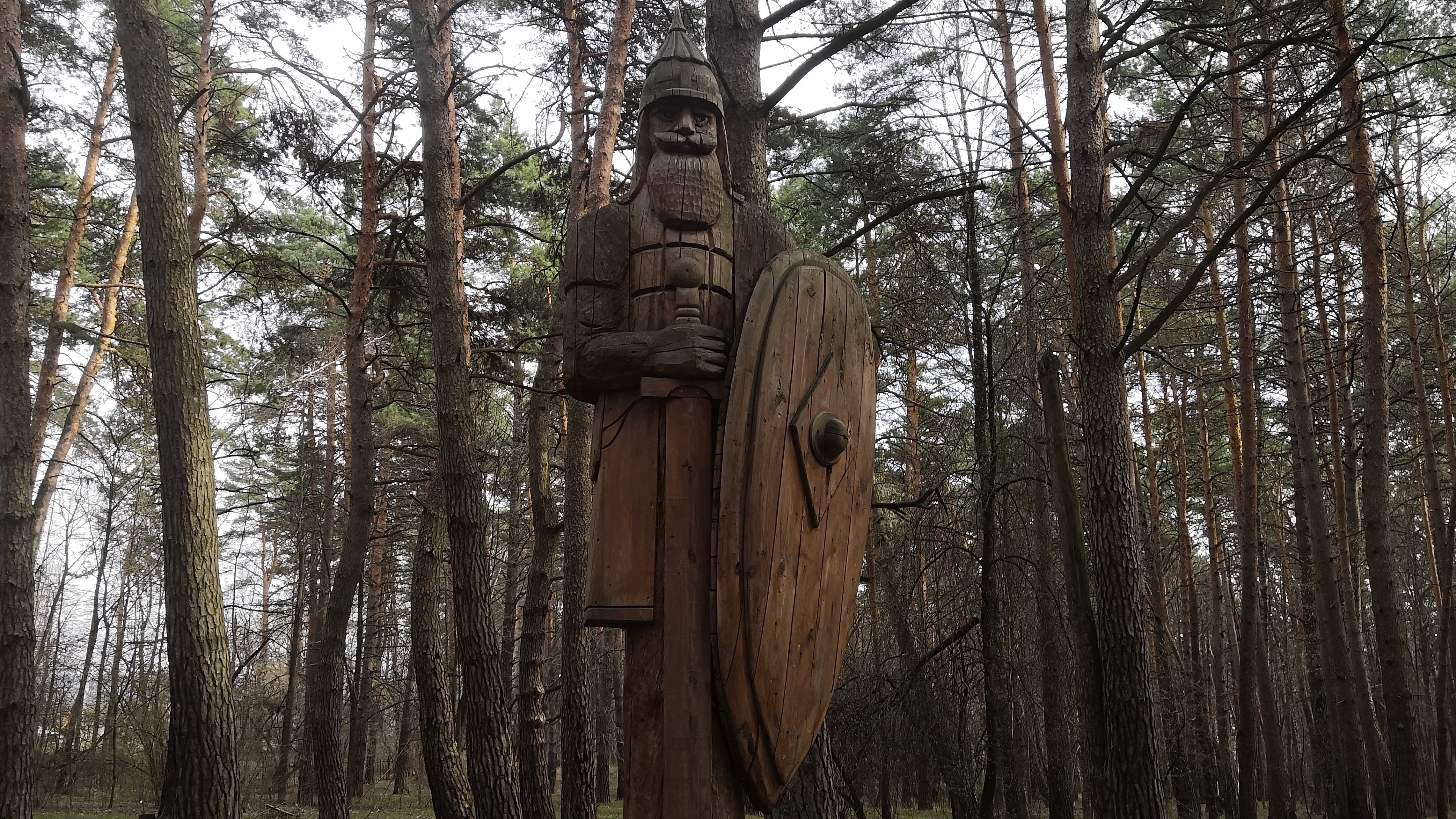 4K Wooden Bogatyr Statue in Forest HD Wallpaper