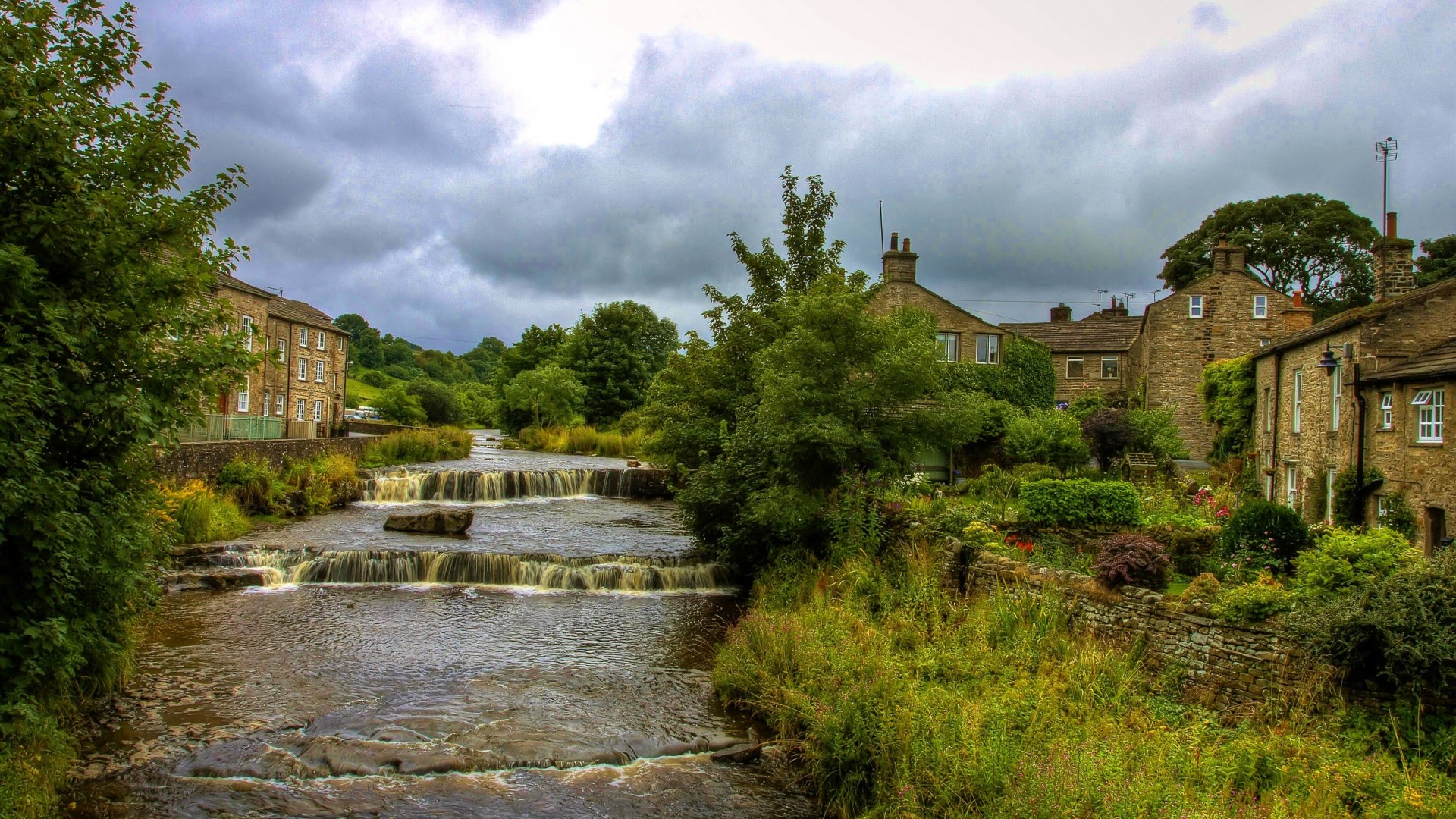 Cascade in England with stone houses HD Wallpaper