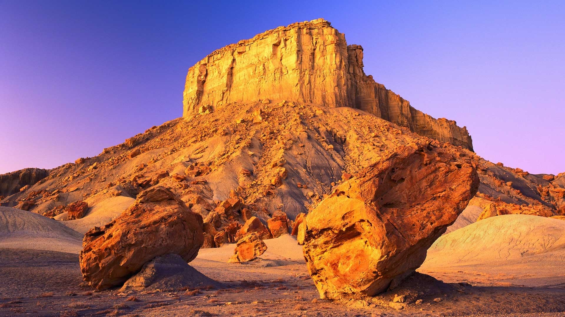 Desert landscape with rock formations at sunset HD Wallpaper