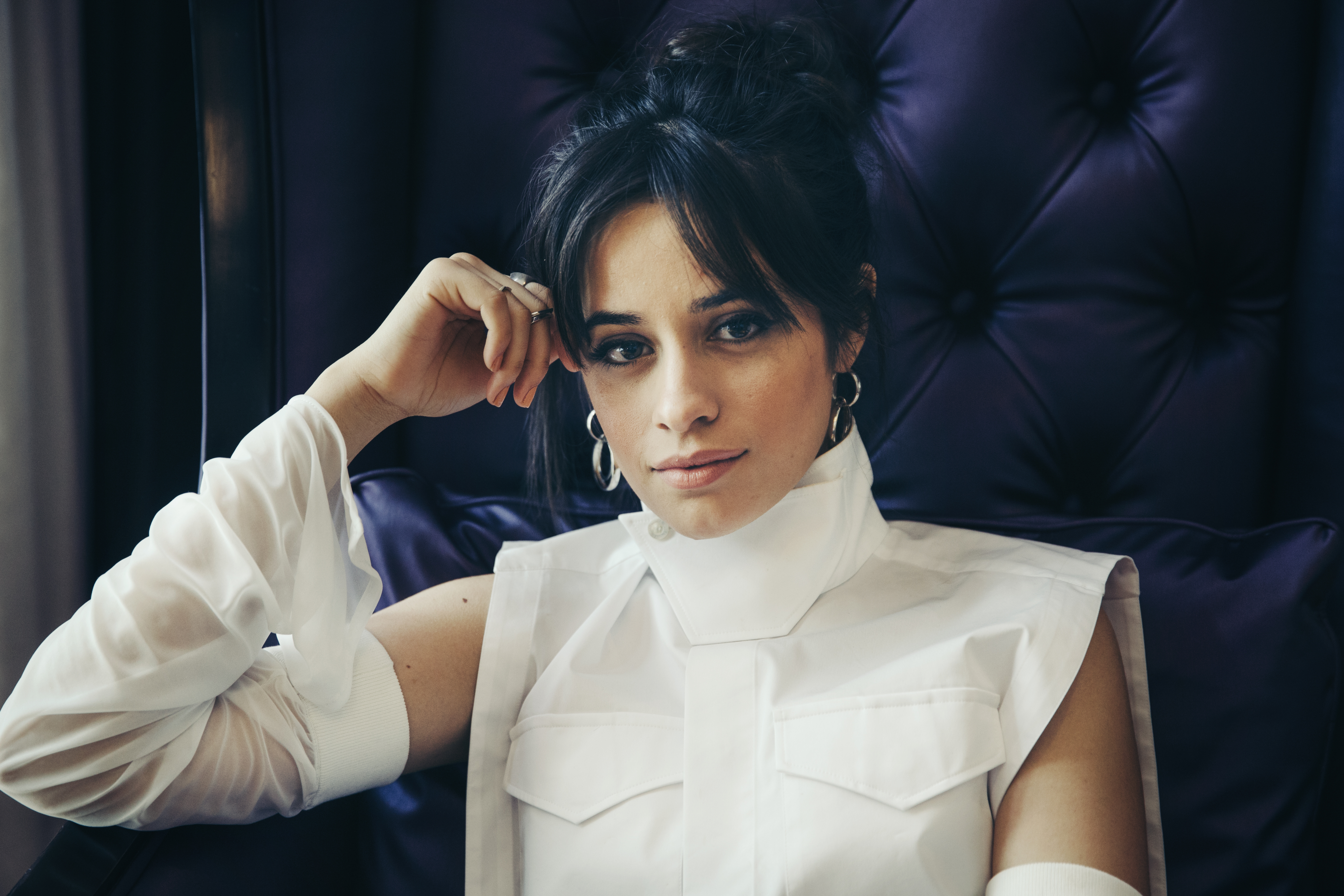 Camila Cabello sitting in a chair HD Wallpaper