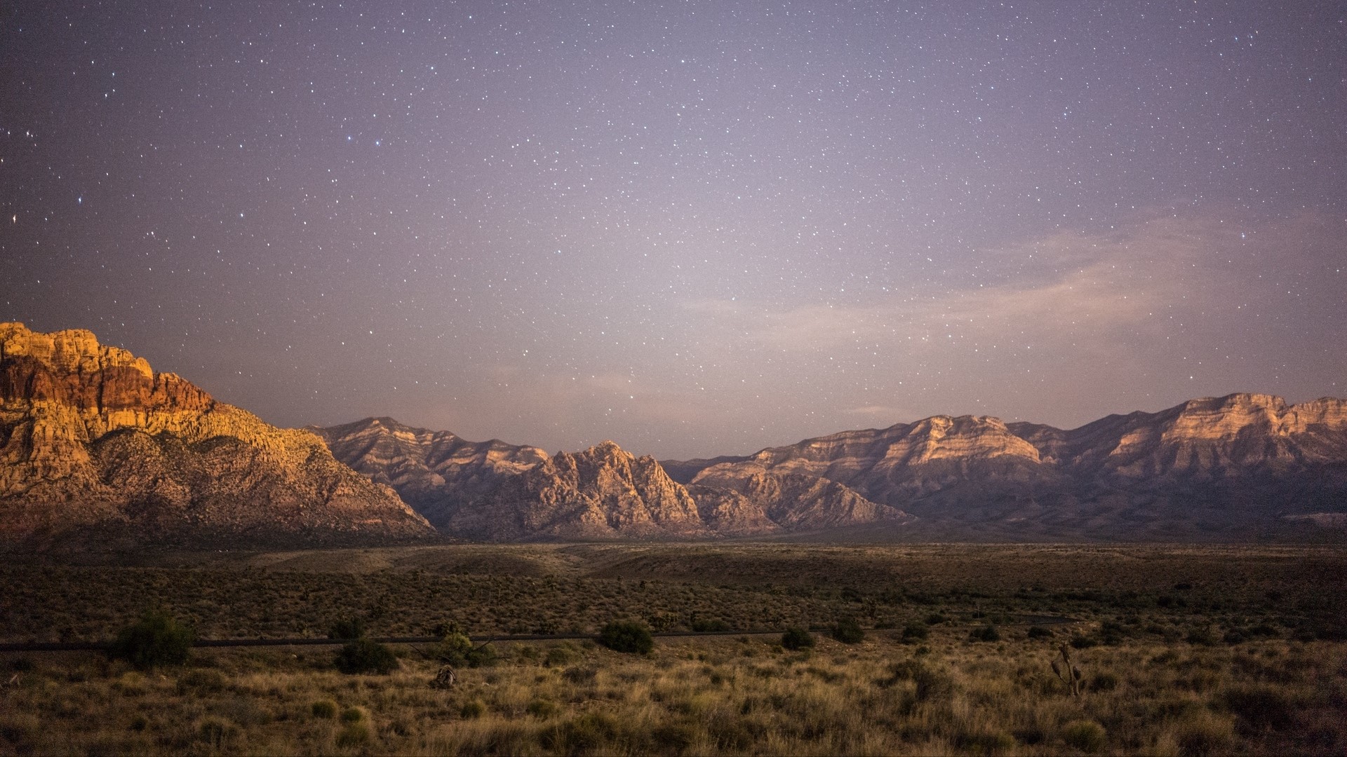 Mountain range under a starry sky HD Wallpaper