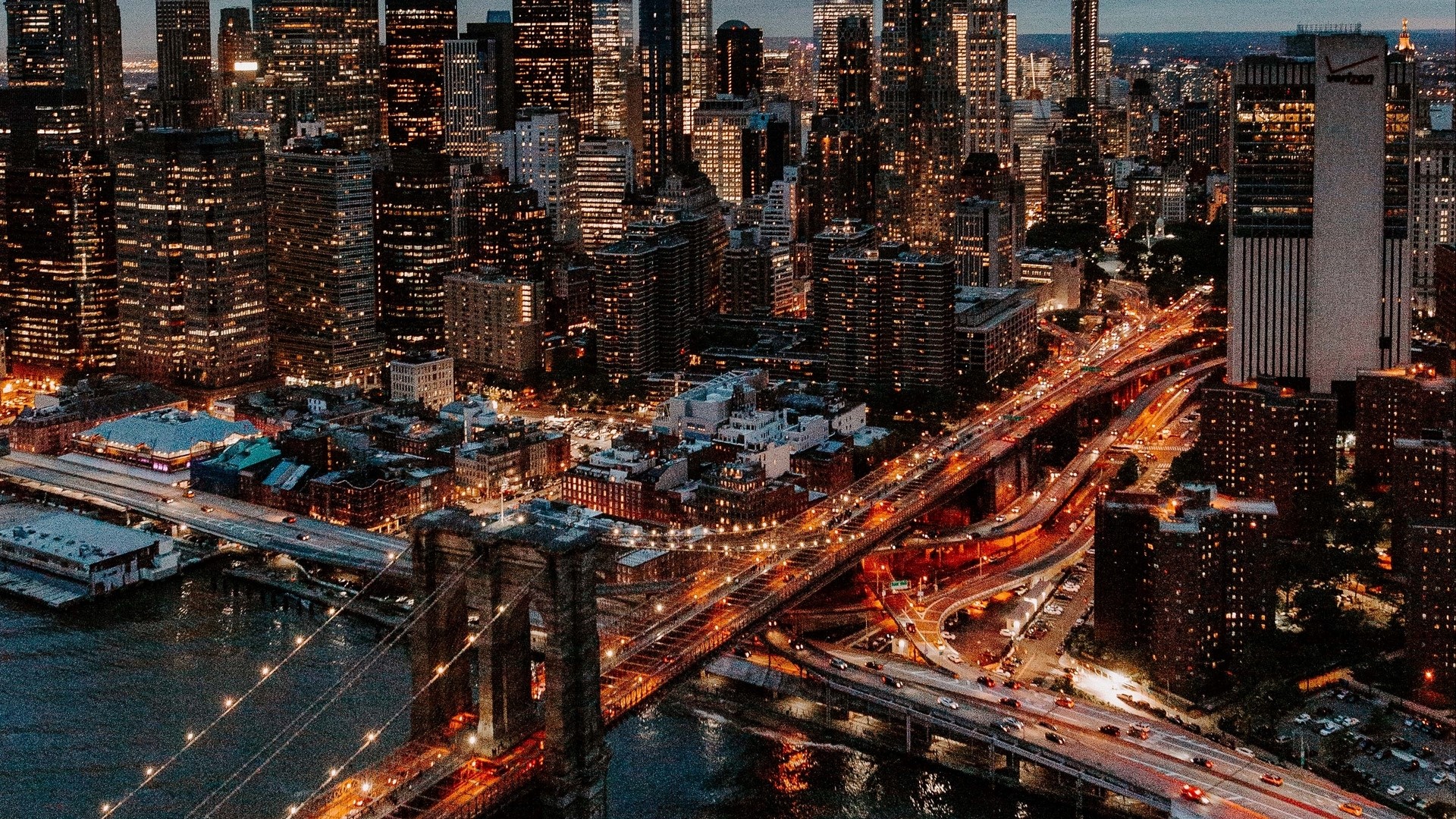 New York City Skyline and Brooklyn Bridge at Night HD Wallpaper