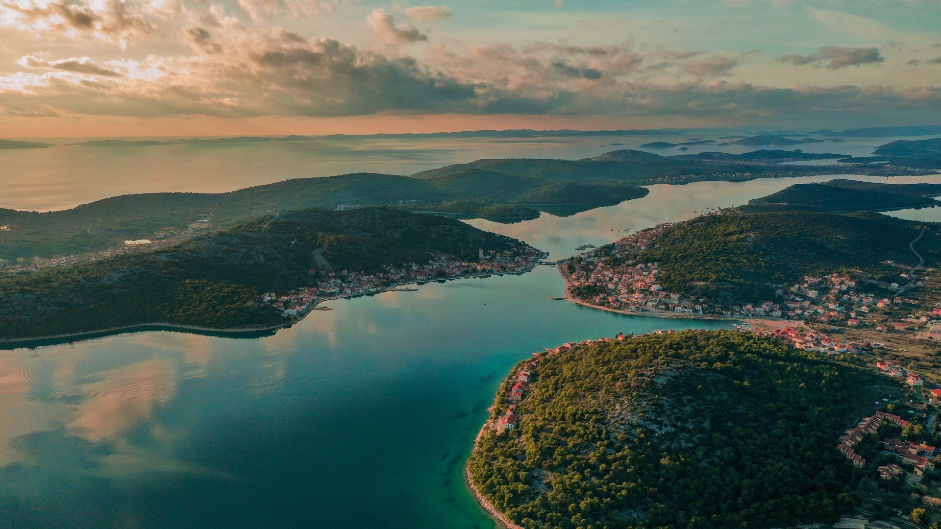 Aerial view of islands and coastline at sunset HD Wallpaper
