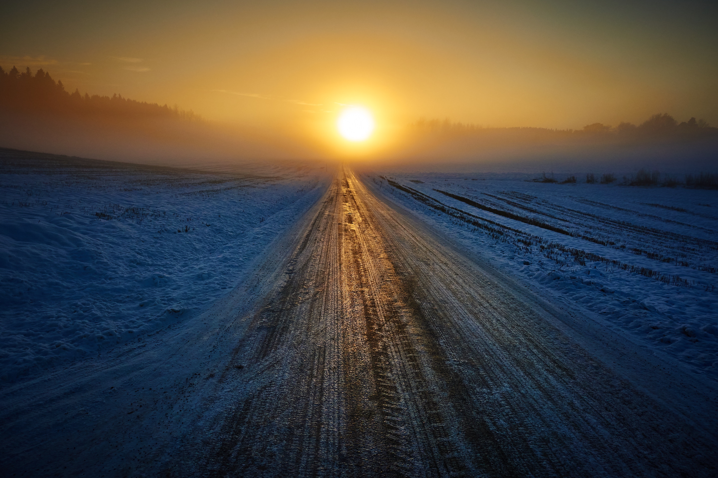 Sunrise over a snowy road in winter HD Wallpaper