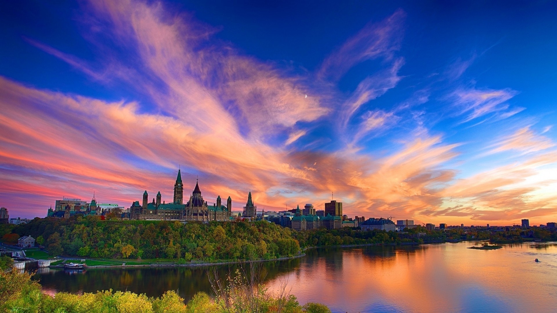 Parliament Hill and Ottawa River at sunset HD Wallpaper