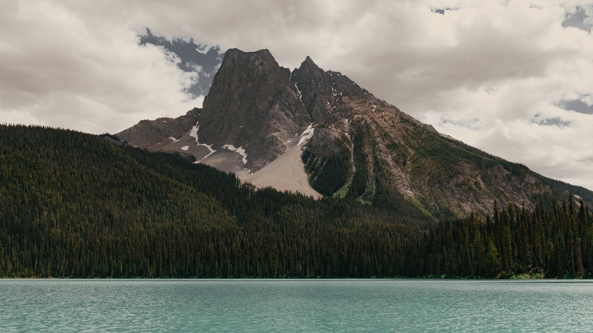 Mountain peak over a forest and lake HD Wallpaper