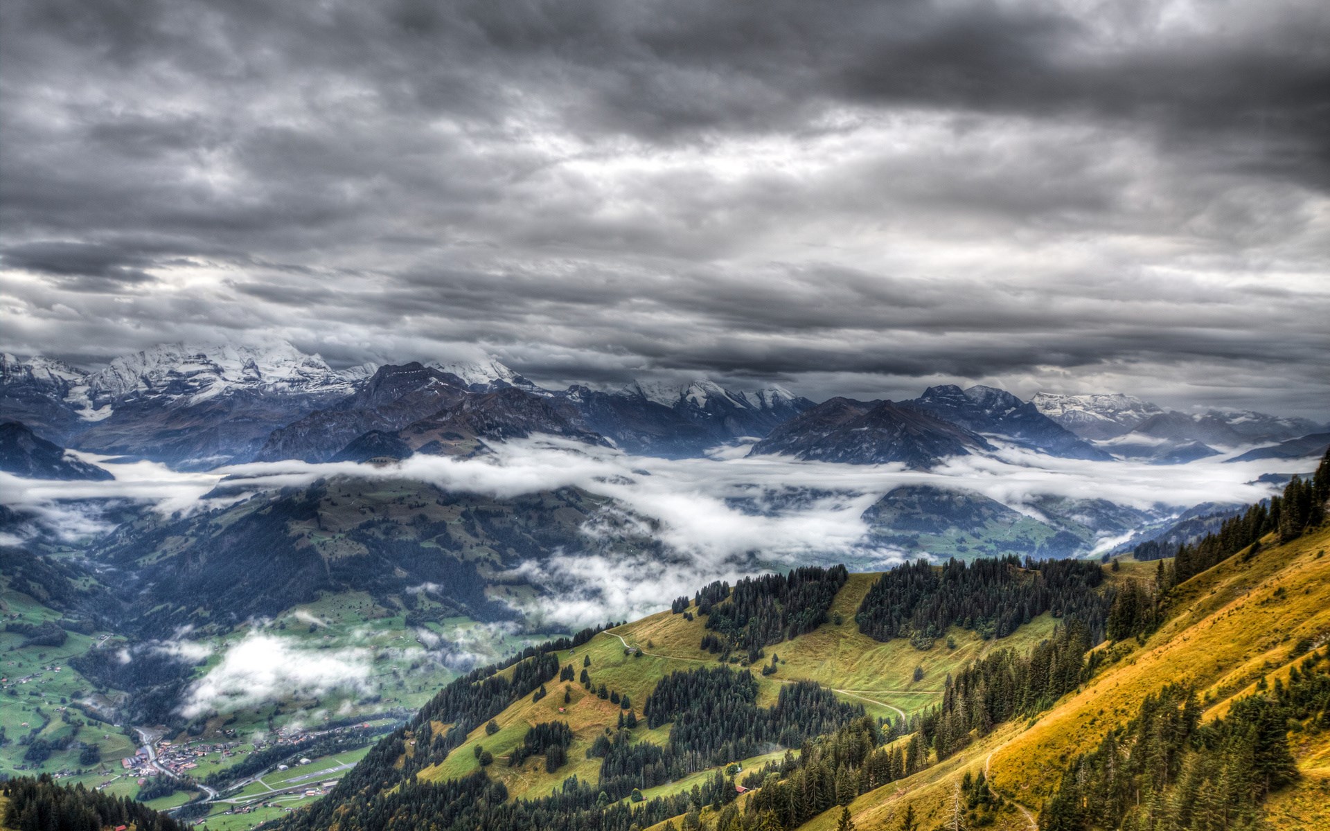 Overcast sky above misty mountains and green valleys HD Wallpaper