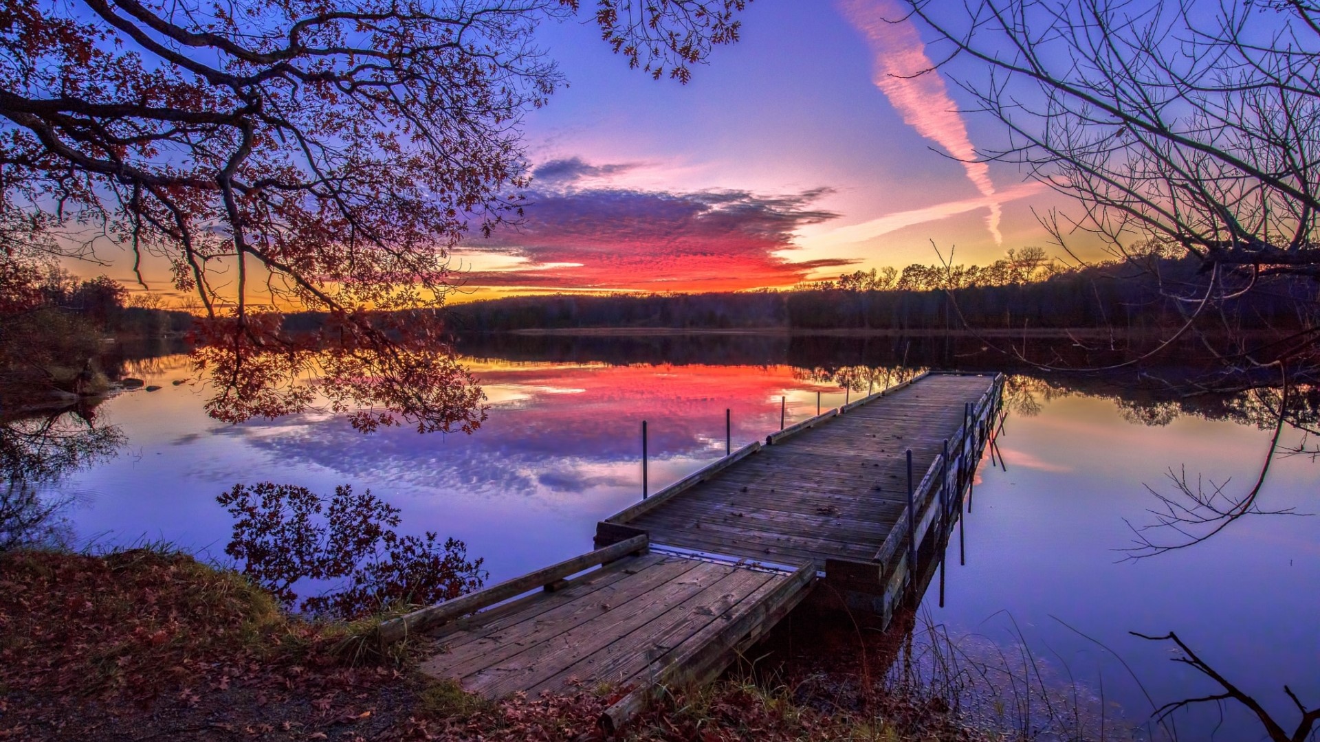 Sunset over a lake with a wooden dock HD Wallpaper