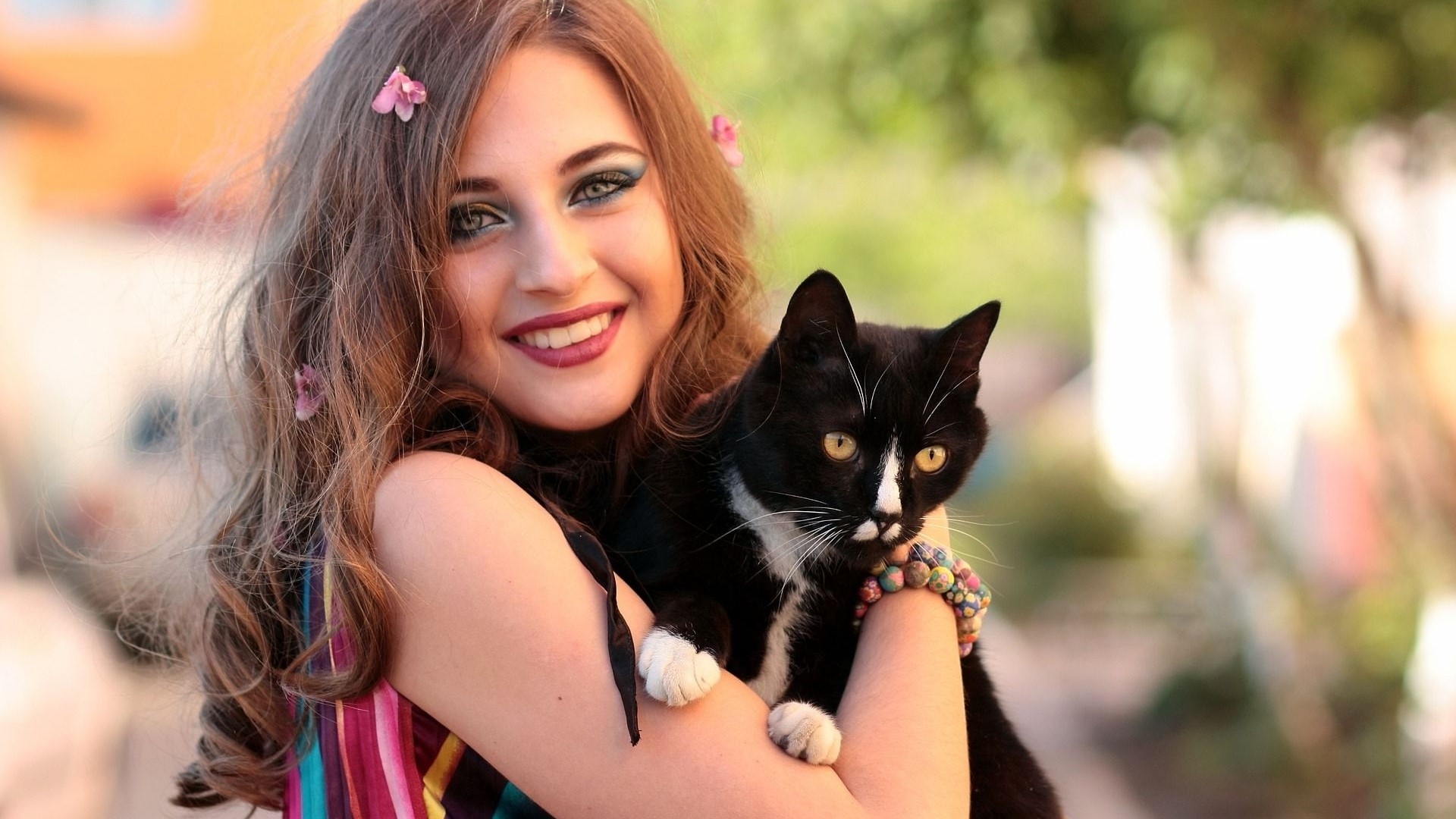 Girl holding a black and white cat HD Wallpaper