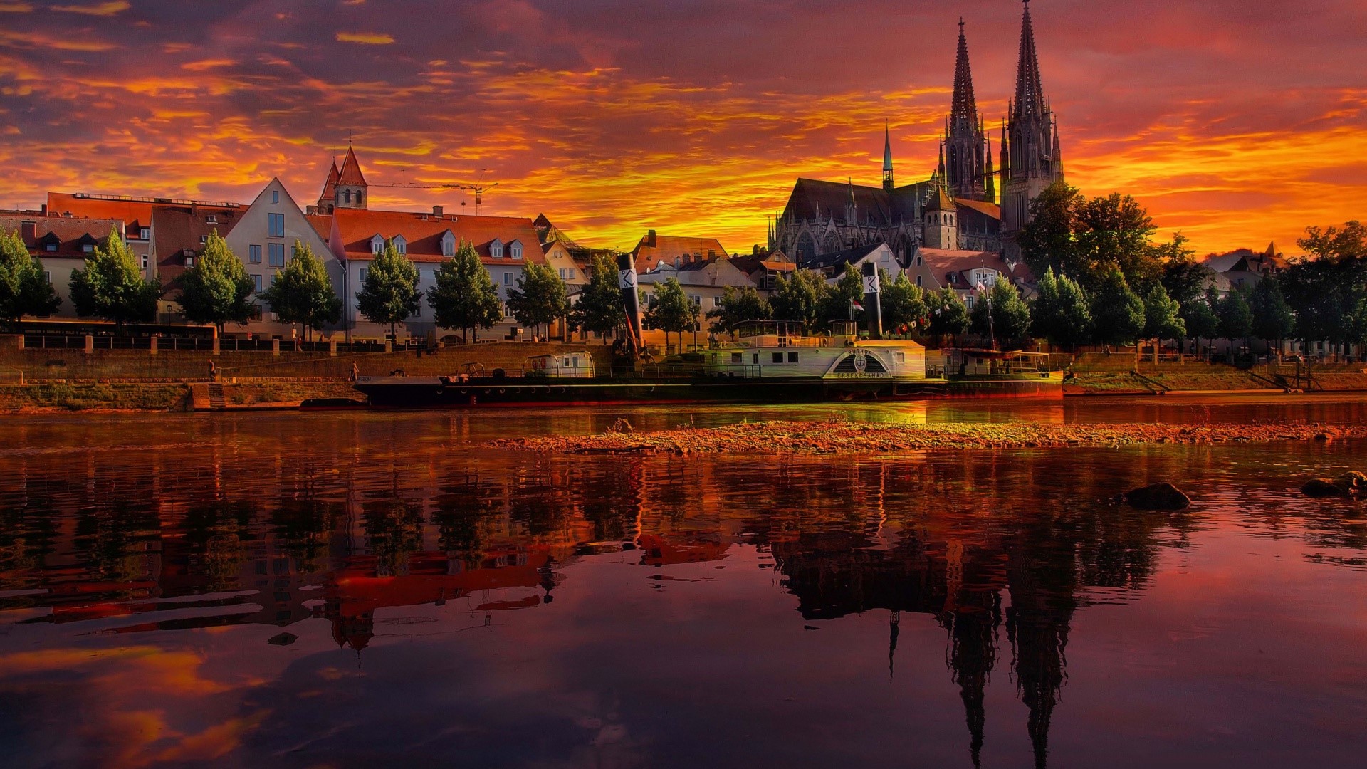 Regensburg city skyline with cathedral and river at sunset HD Wallpaper