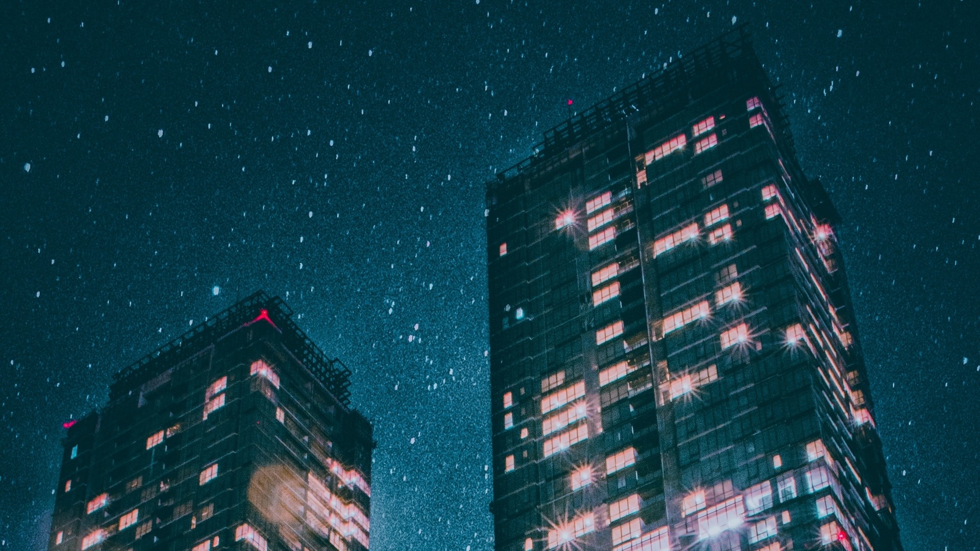 Two skyscrapers at night with stars HD Wallpaper