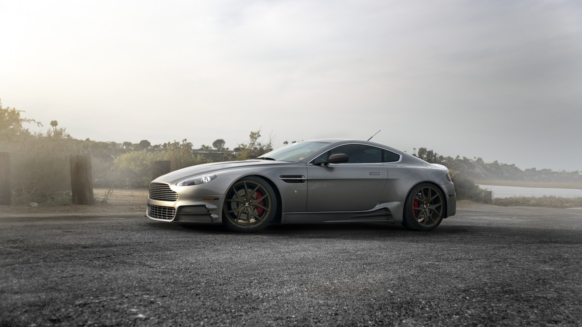 Aston Martin Vantage parked on a road HD Wallpaper
