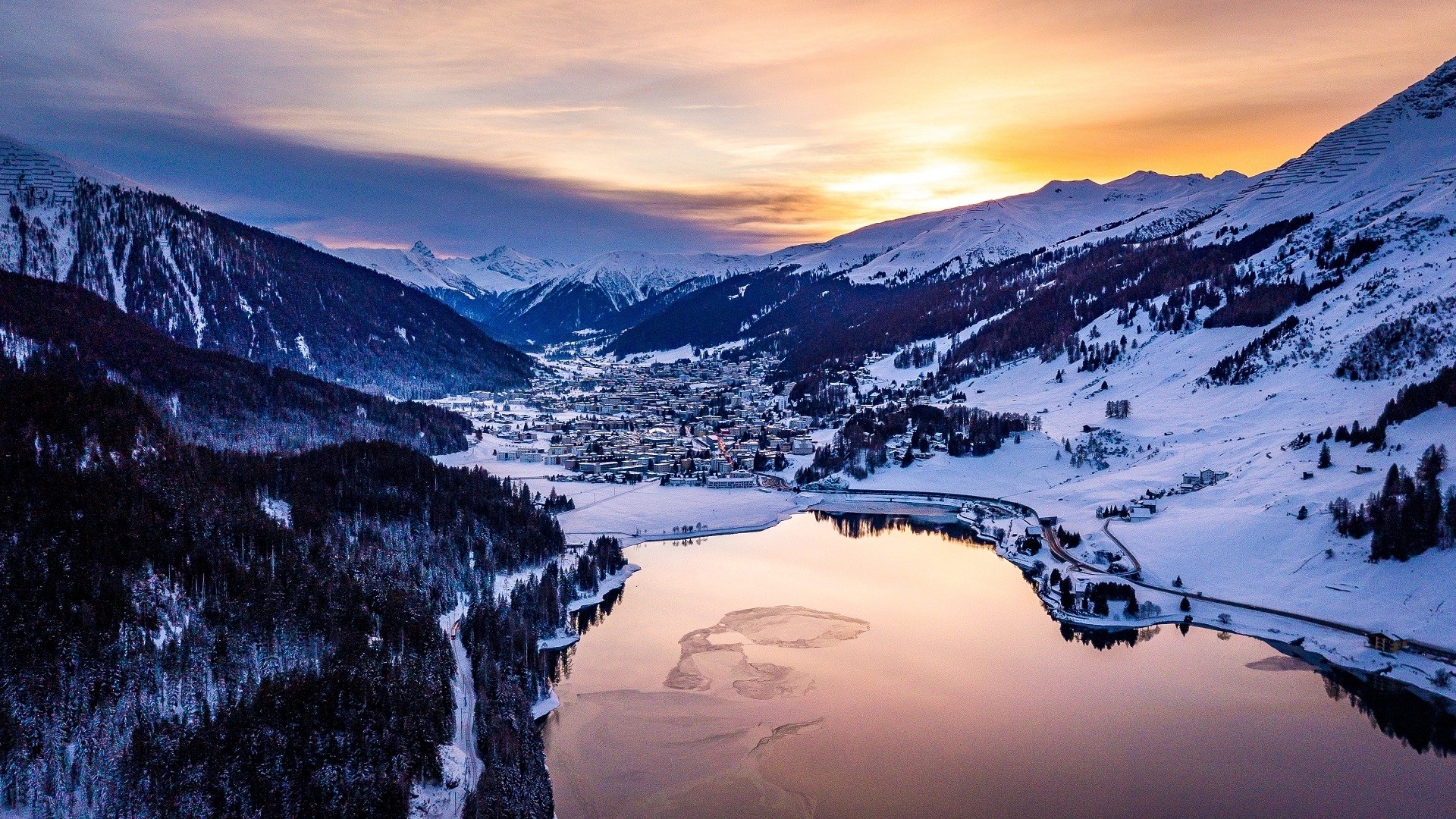 Snowy mountain valley with lake at sunset HD Wallpaper