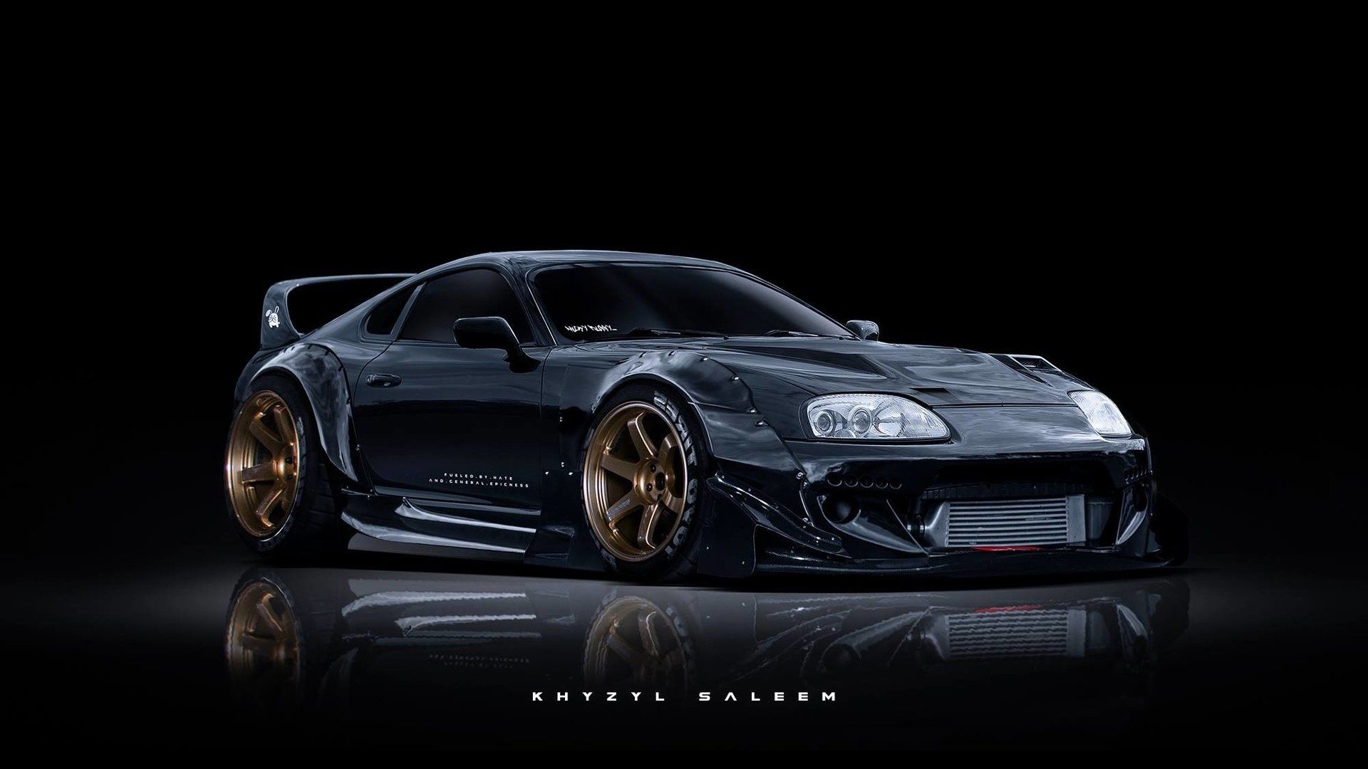 Modified black Toyota Supra with gold rims HD Wallpaper
