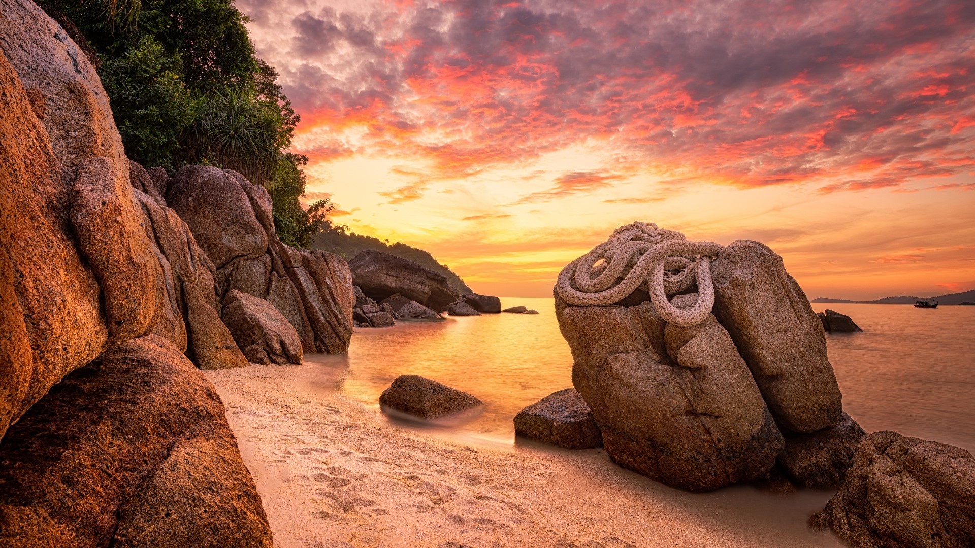 Rocky coast with rope at sunset HD Wallpaper