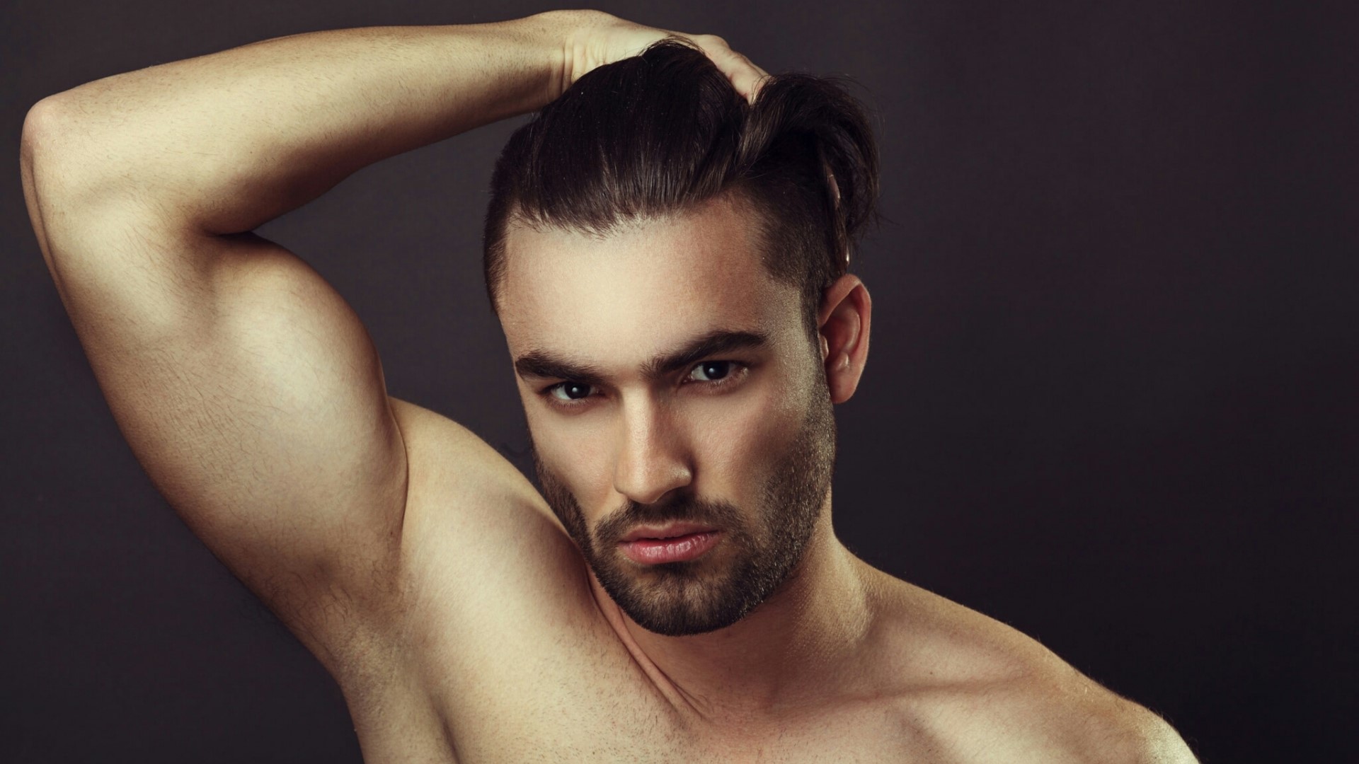 Man with hand in hair HD Wallpaper