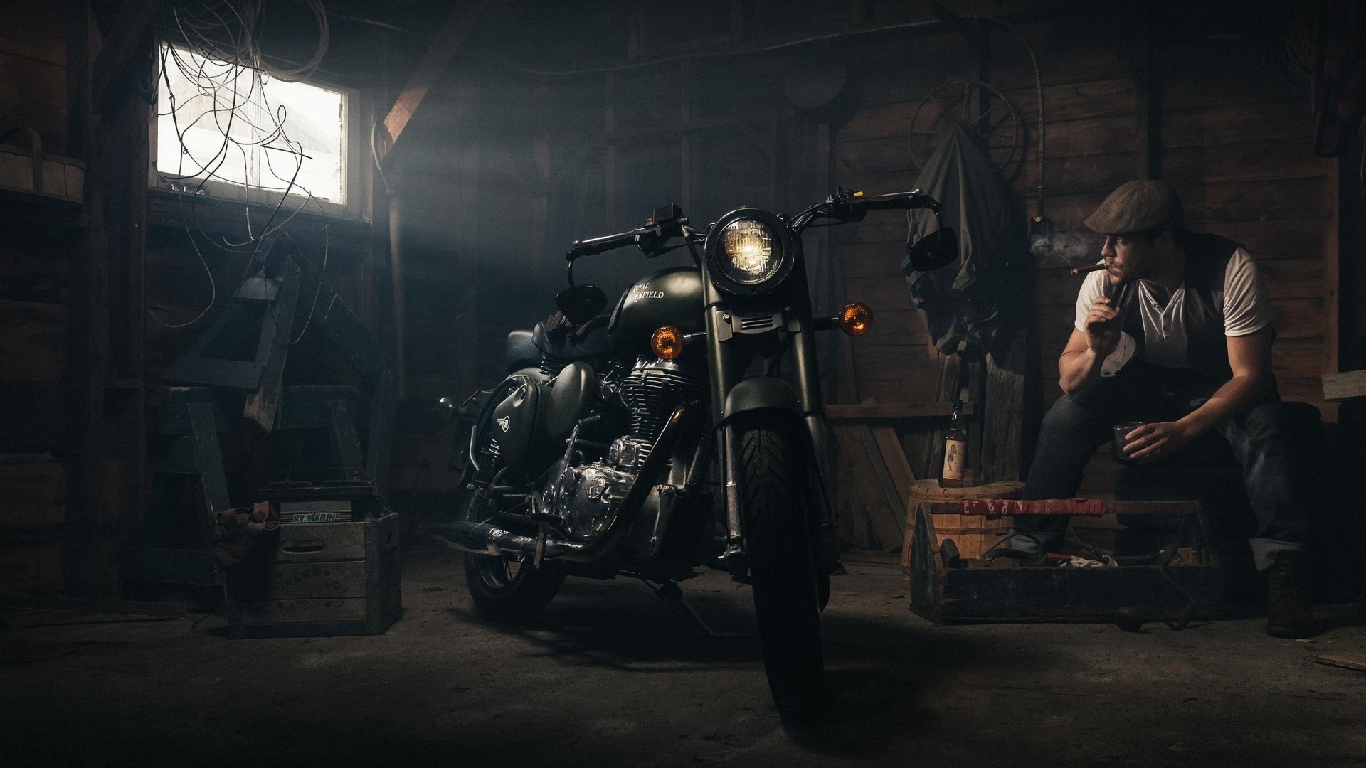 Man smoking in a garage with a motorcycle HD Wallpaper