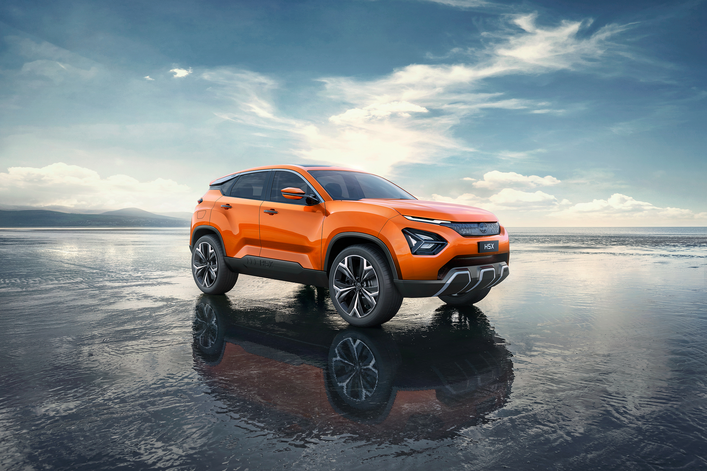 Orange Tata H5X concept car on a wet surface HD Wallpaper