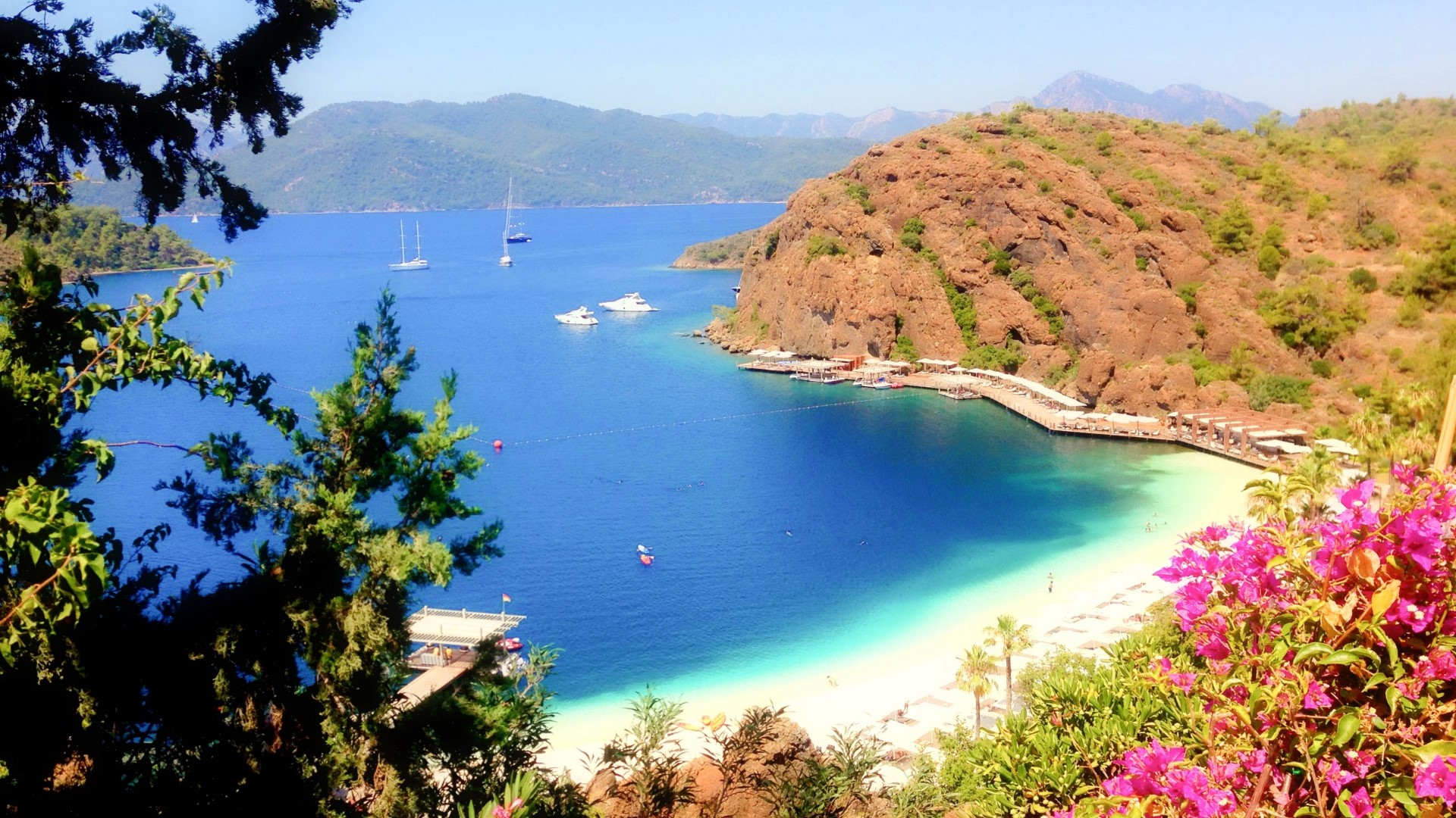 Beautiful bay with boats and beach HD Wallpaper