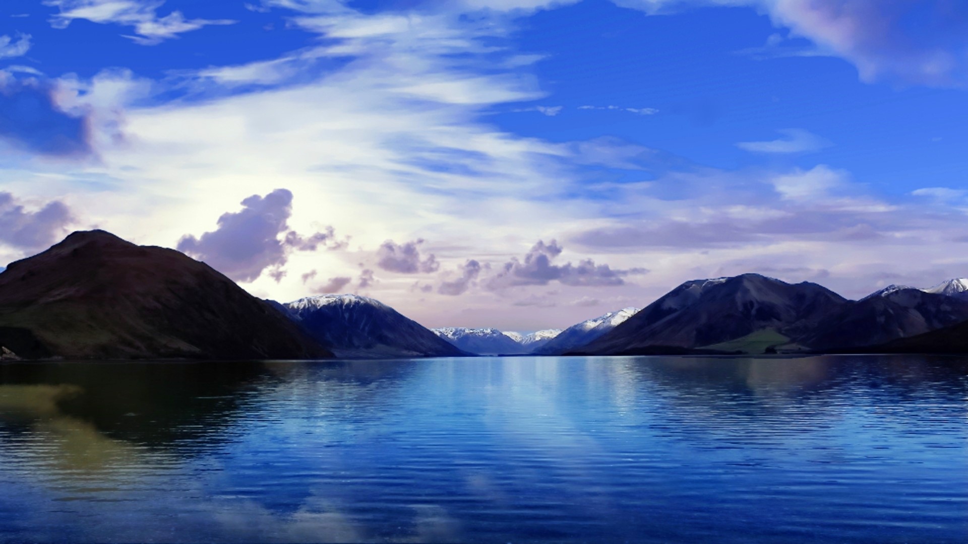 Lake and Mountains Under a Cloudy Blue Sky HD Wallpaper