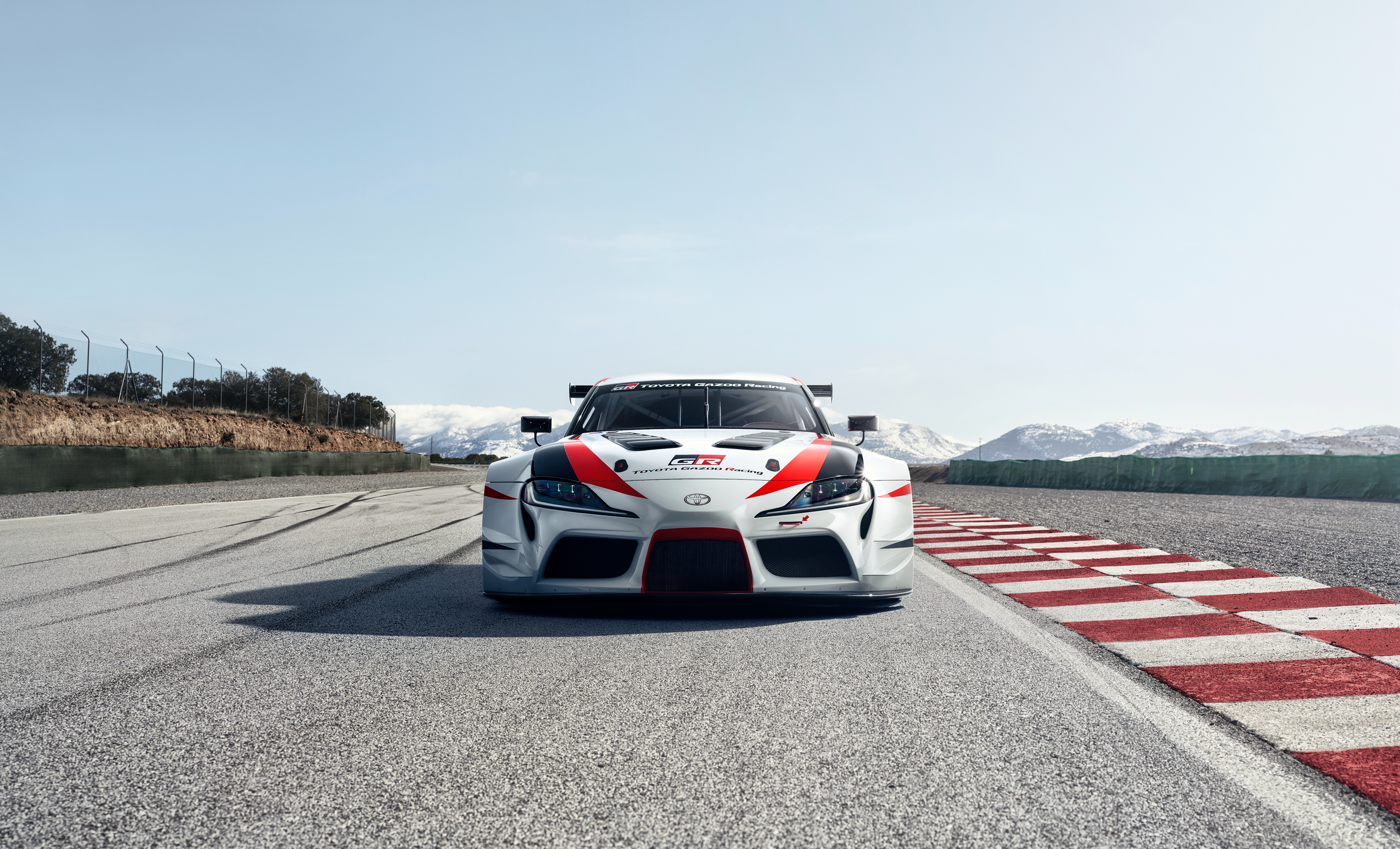 Toyota GR Supra Racing Concept on a Racetrack HD Wallpaper
