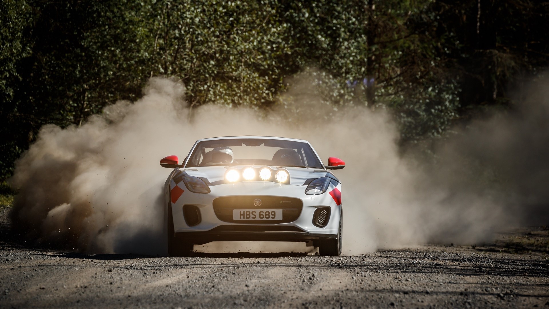 Jaguar F-Type rally car driving through dust HD Wallpaper