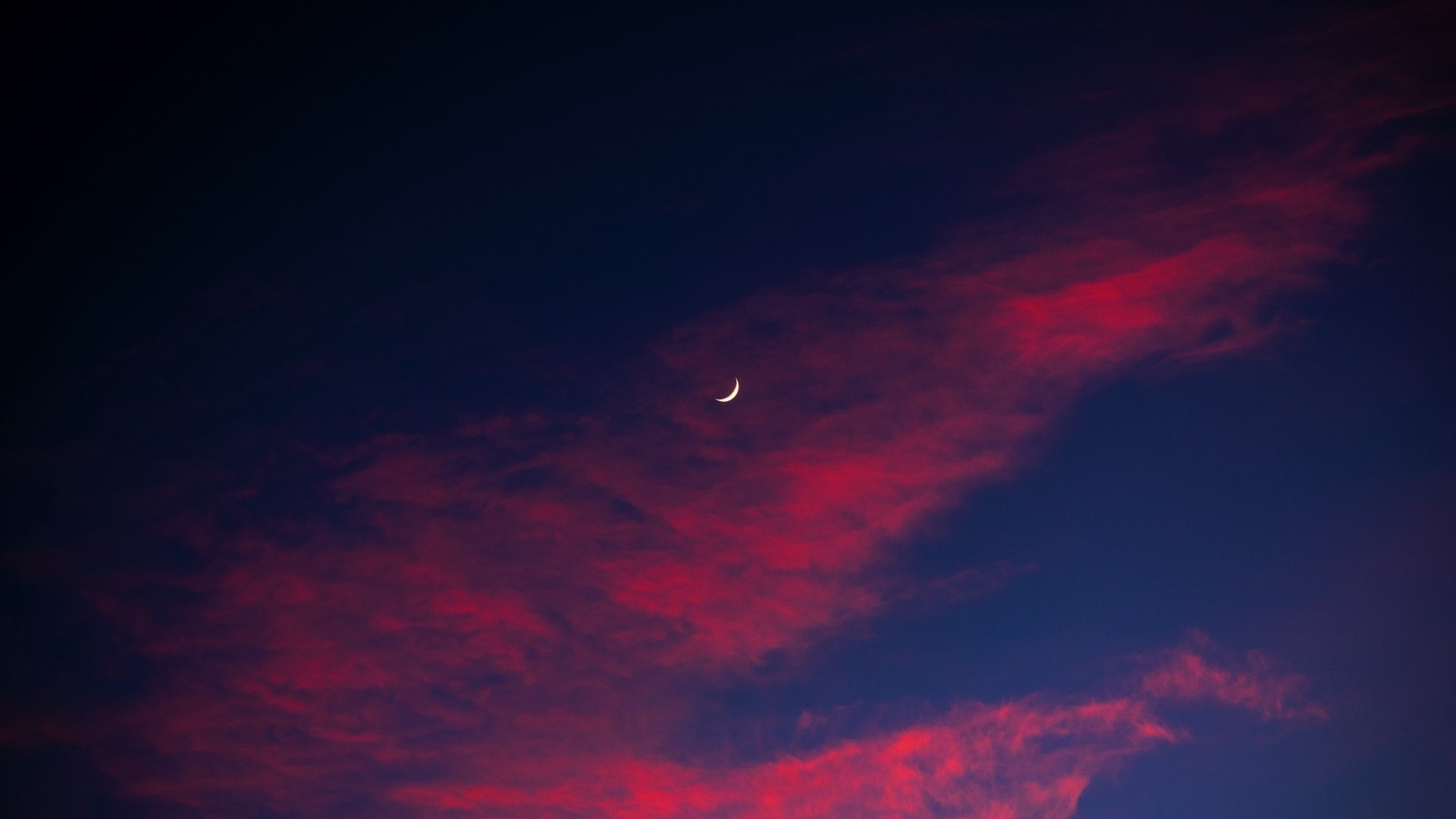 Crescent moon in a twilight sky with red clouds HD Wallpaper