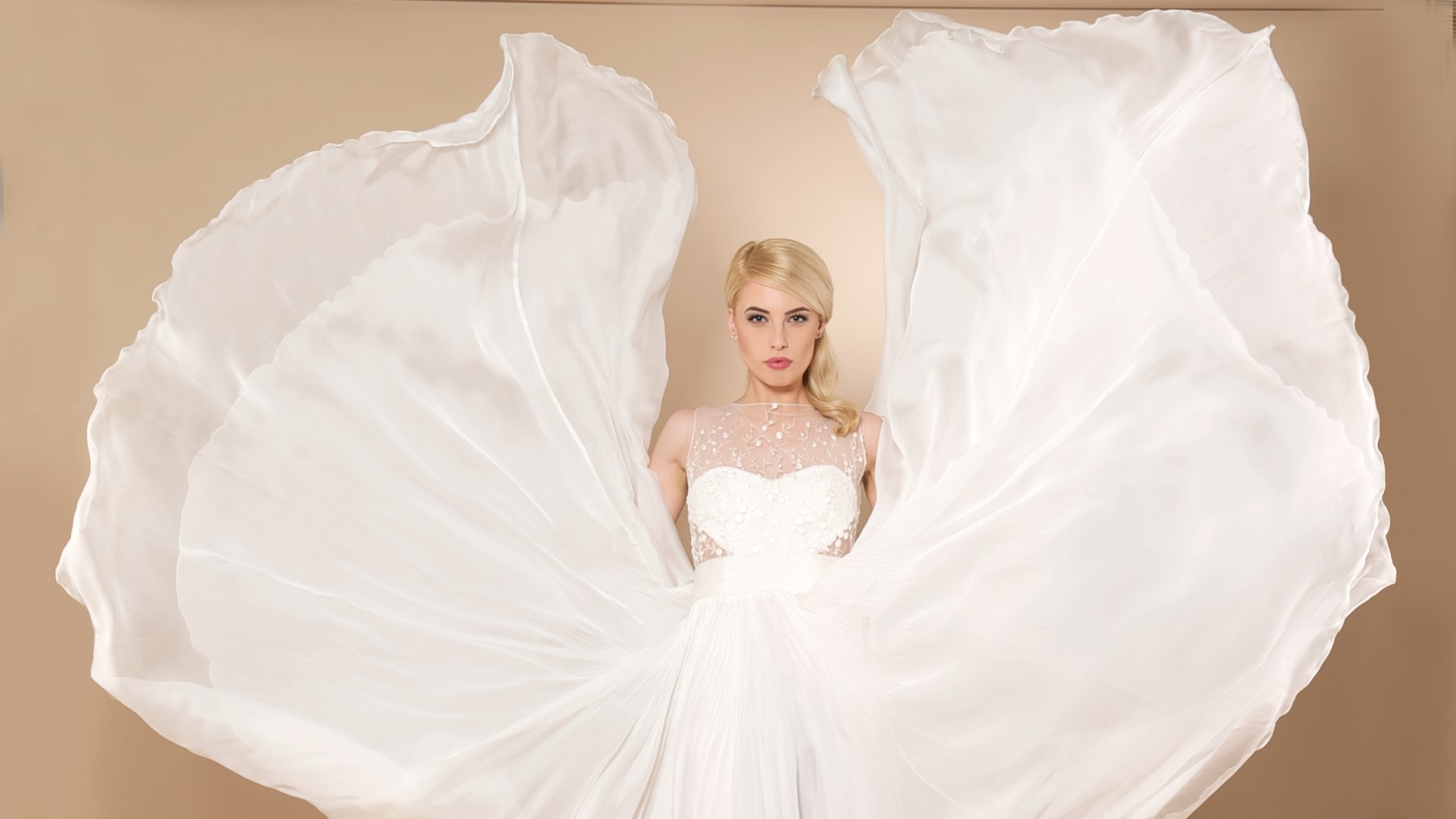 Woman in a white wedding dress with flowing fabric HD Wallpaper