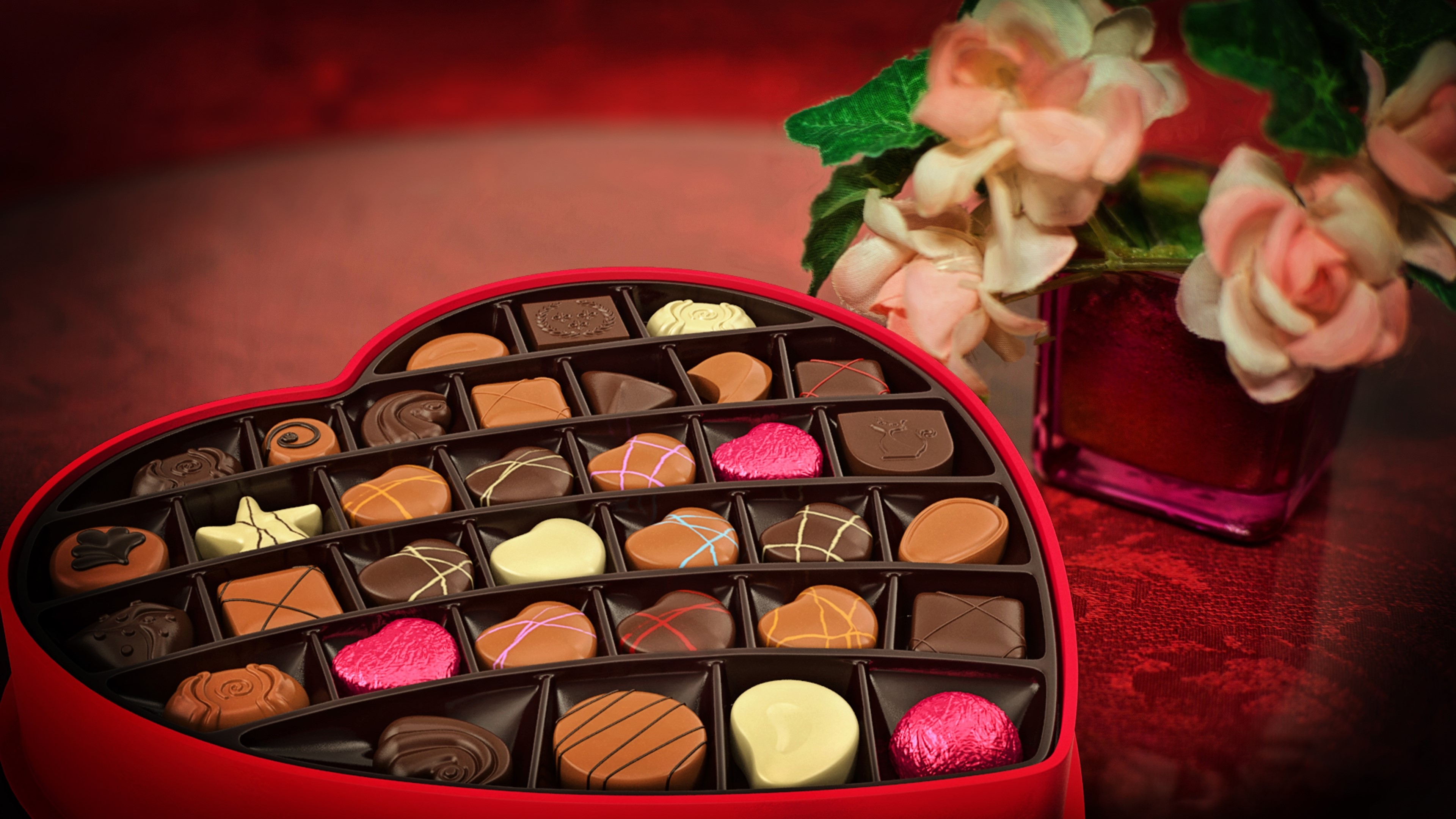 Heart-shaped box of chocolates with flowers HD Wallpaper