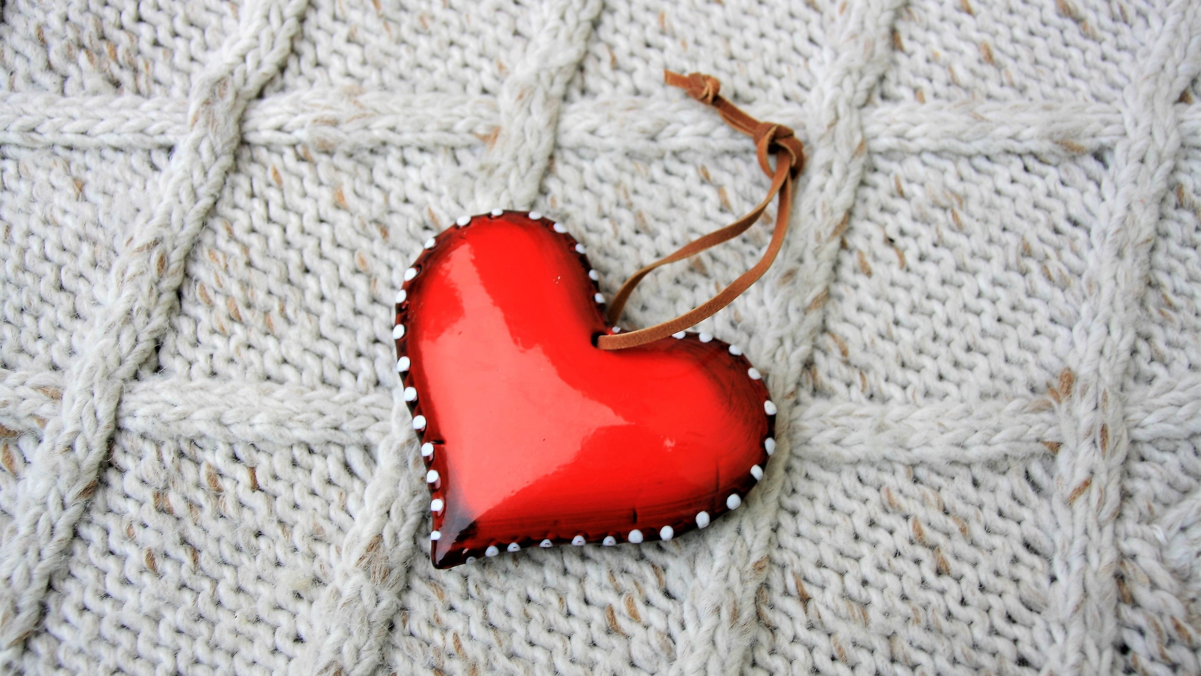Red heart ornament on knitted background HD Wallpaper