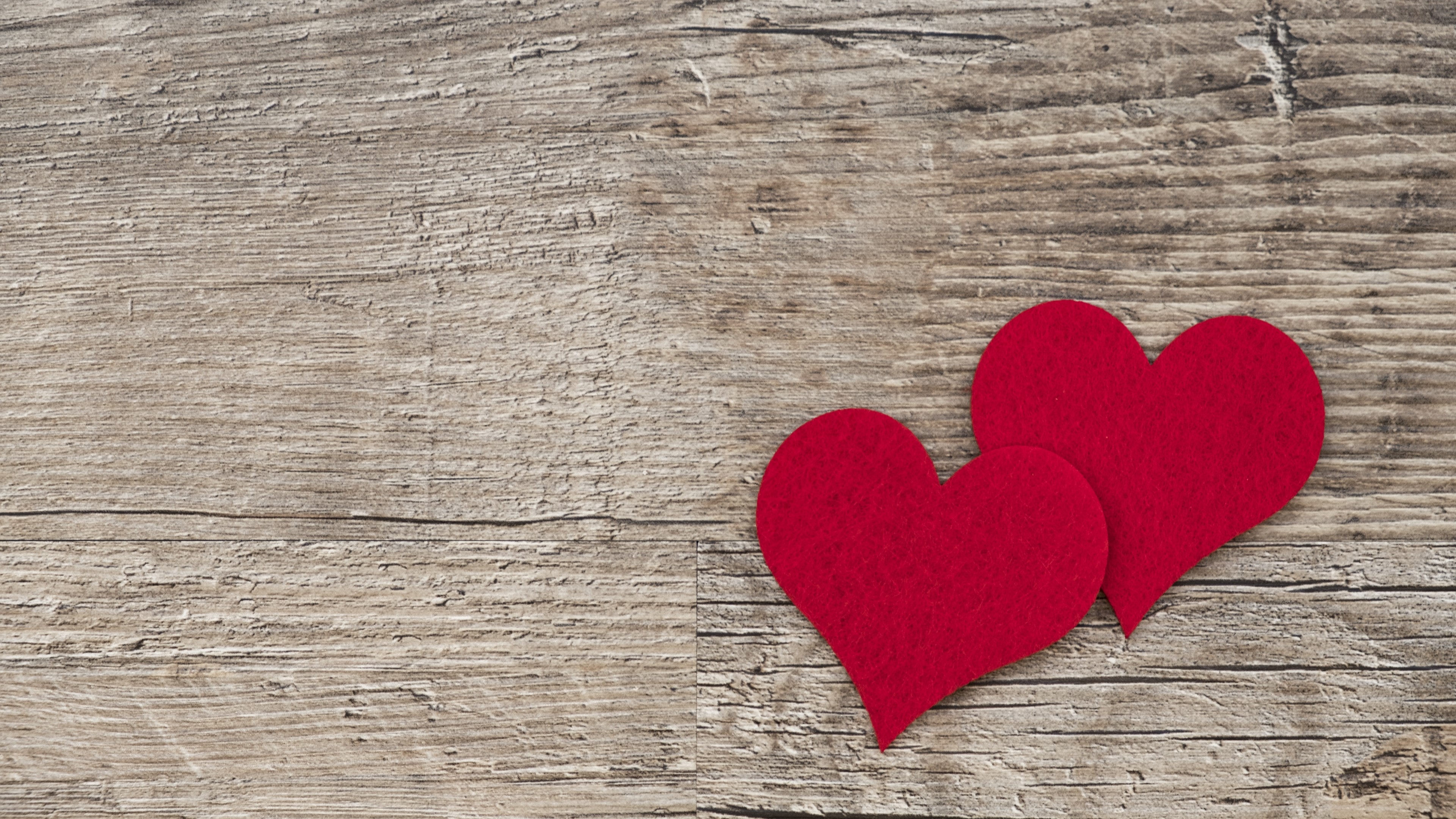 Two red hearts on a wooden background HD Wallpaper