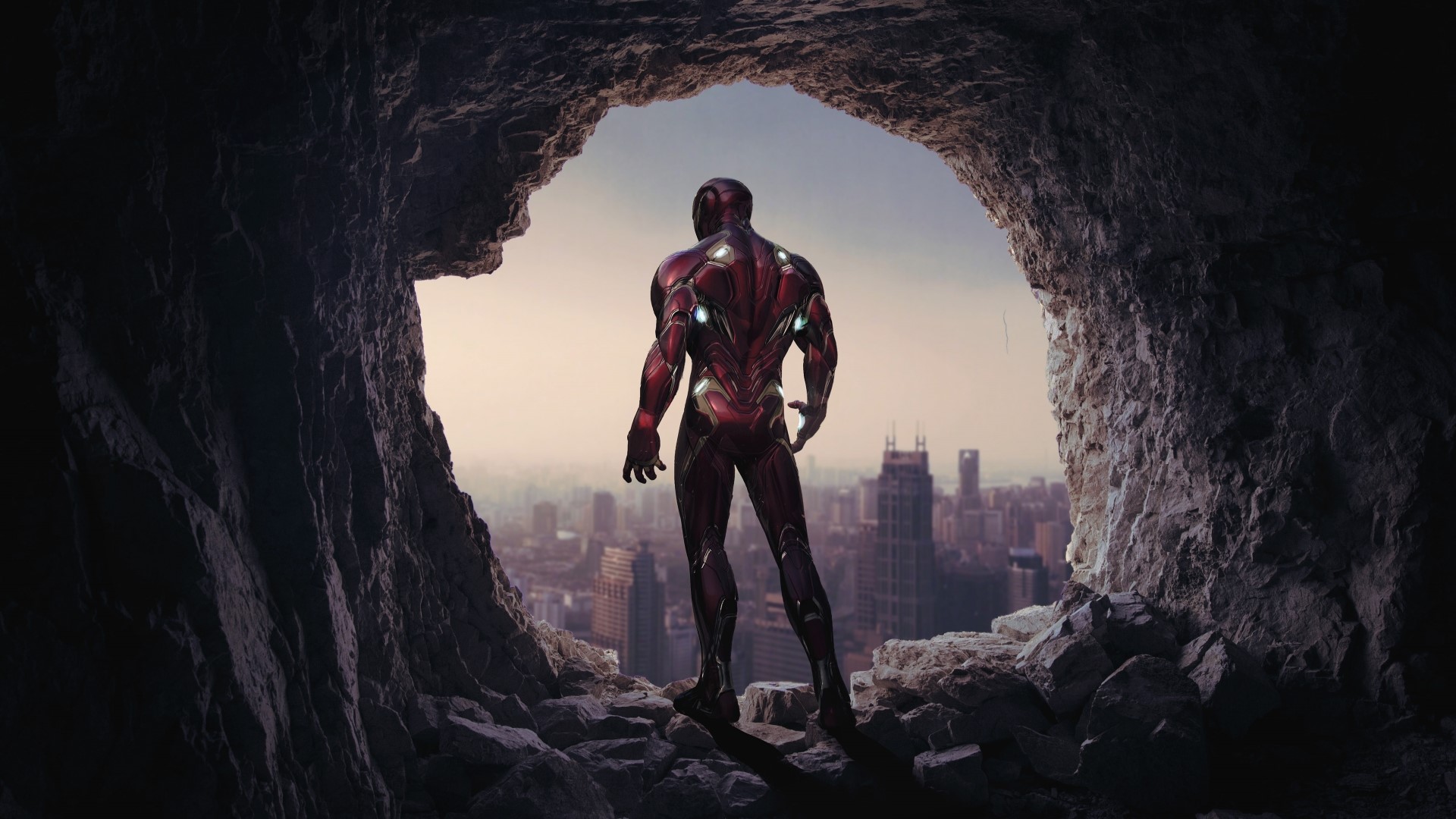 Iron Man from Avengers Endgame in a cave overlooking a city HD Wallpaper