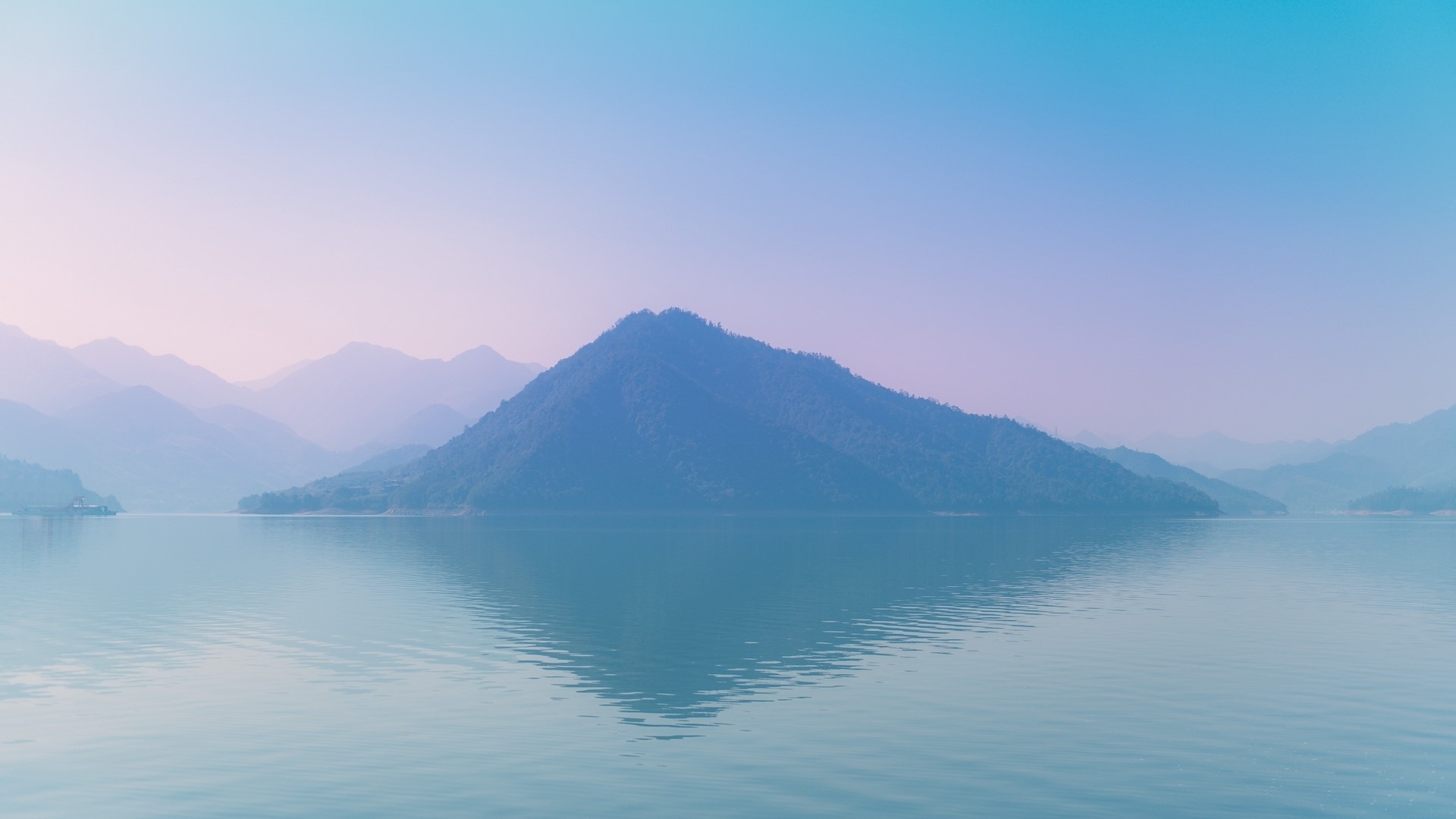Island mountain reflected in calm water at sunrise HD Wallpaper