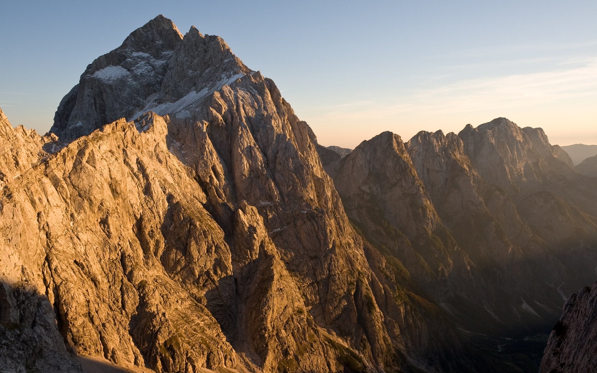 Jagged mountain range at sunset HD Wallpaper