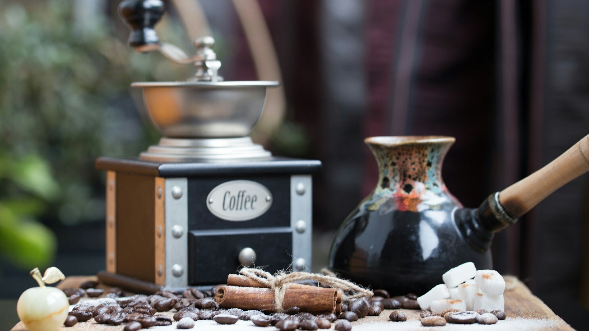 Coffee grinder, cezve, cinnamon sticks, sugar cubes, and coffee beans HD Wallpaper