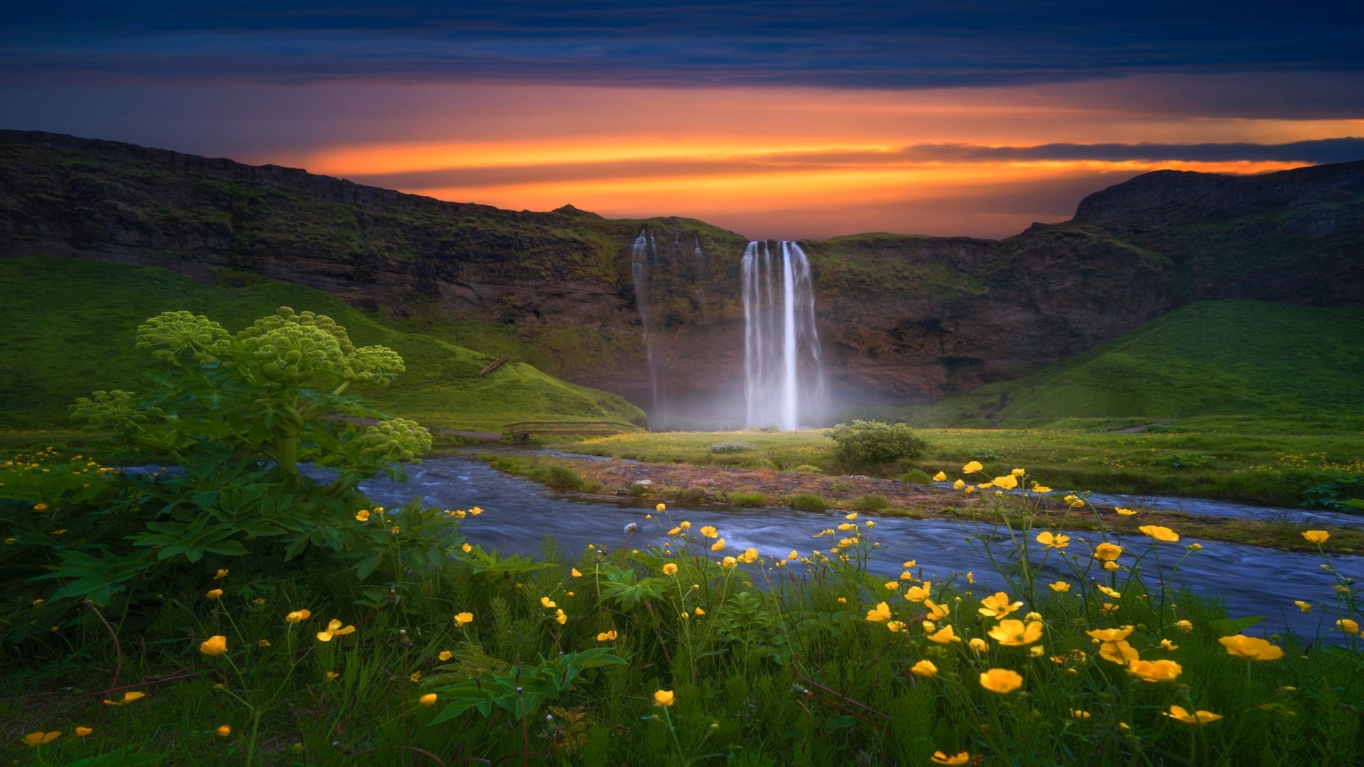 Waterfall in a valley at sunset HD Wallpaper