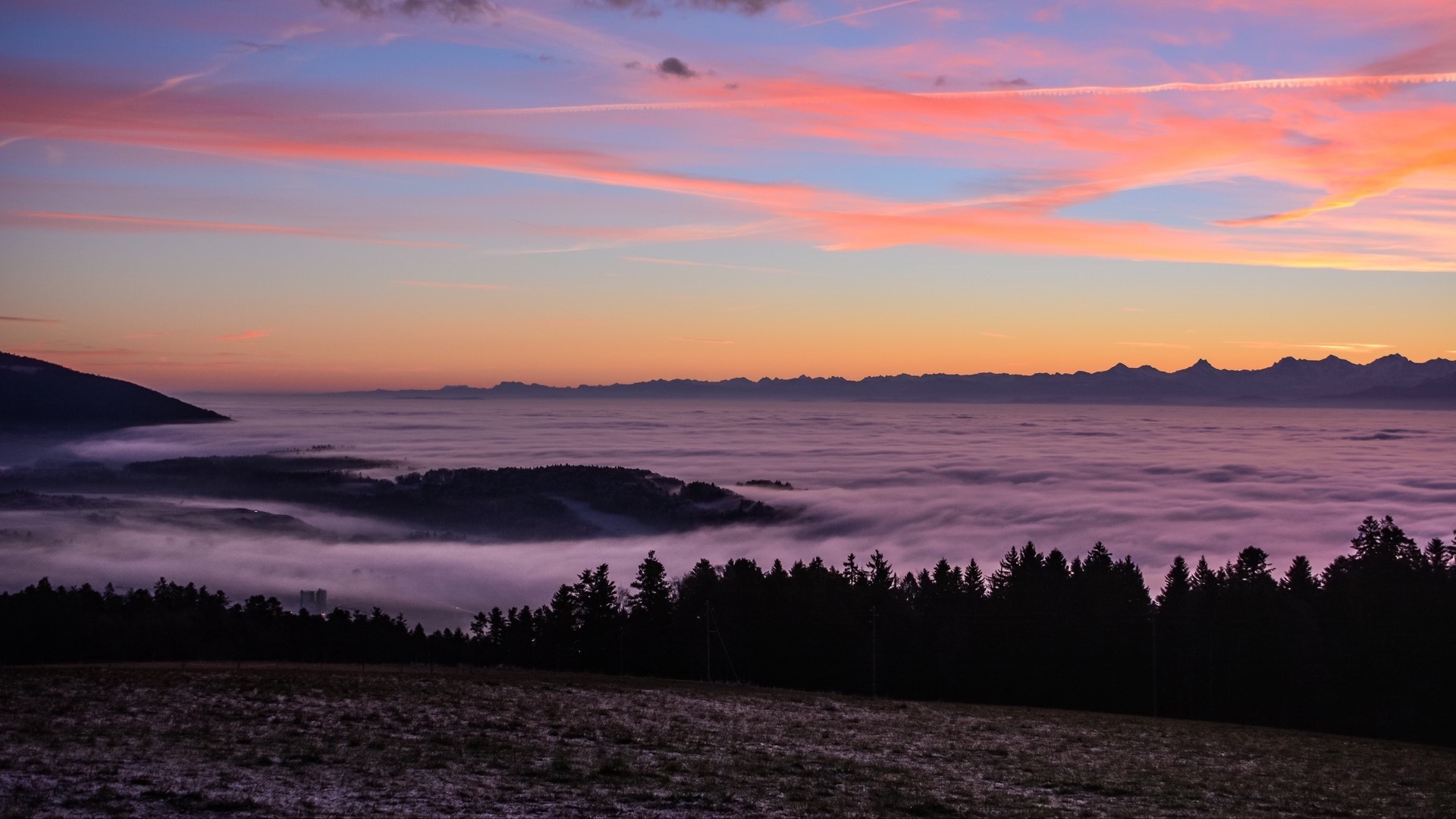 Sunset over a foggy valley with mountains HD Wallpaper