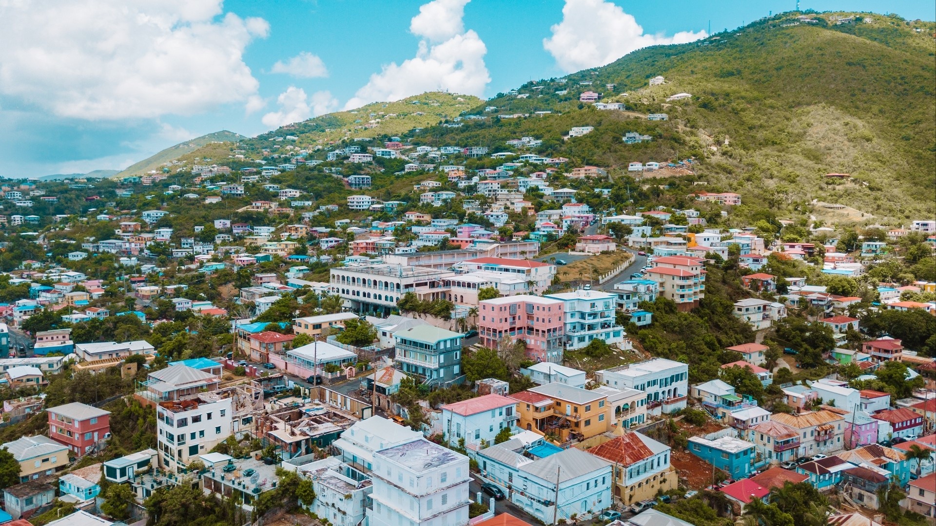 Aerial view of colorful buildings on a hillside in the Virgin Islands HD Wallpaper