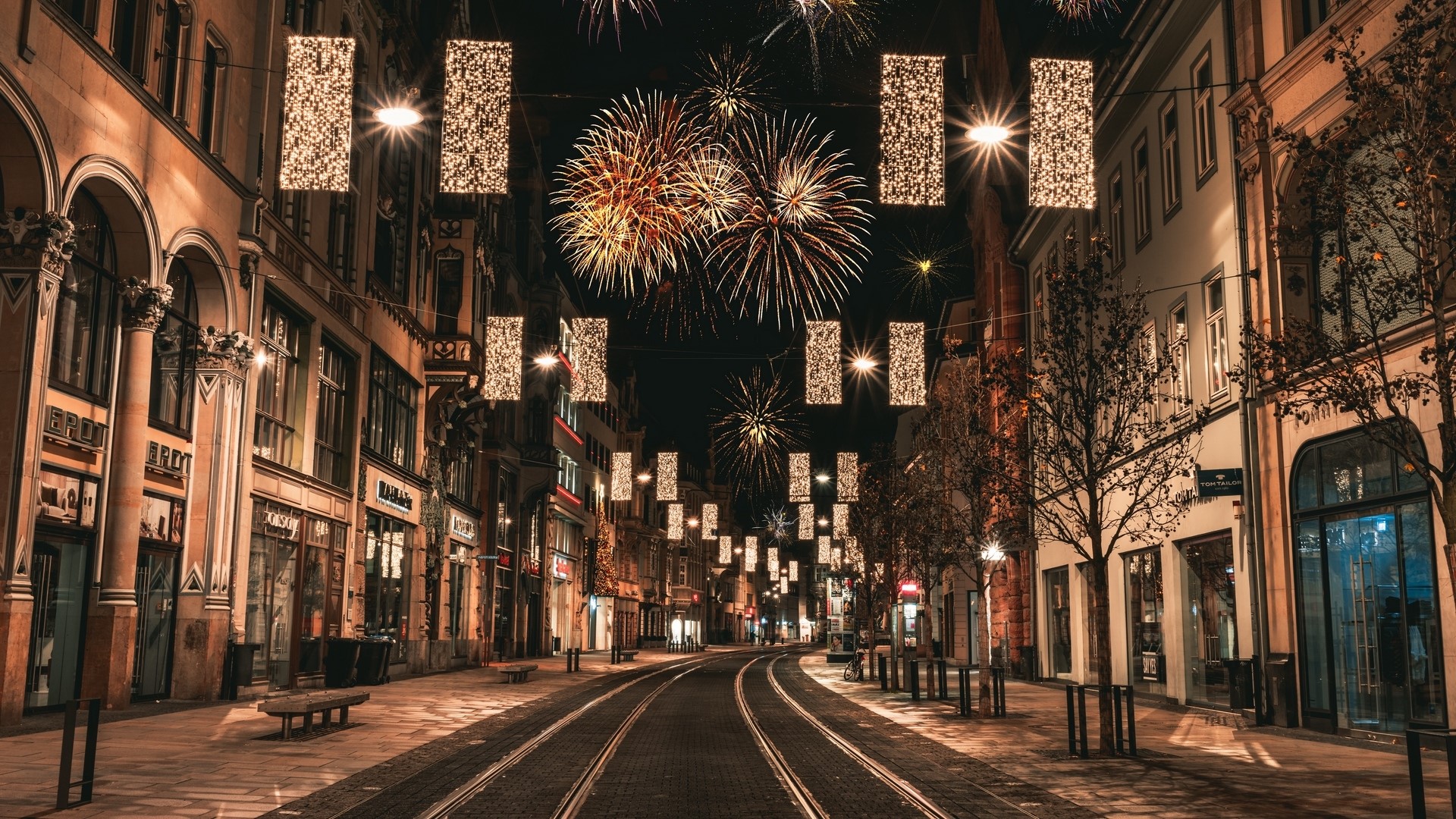 City street at night with fireworks and lights HD Wallpaper
