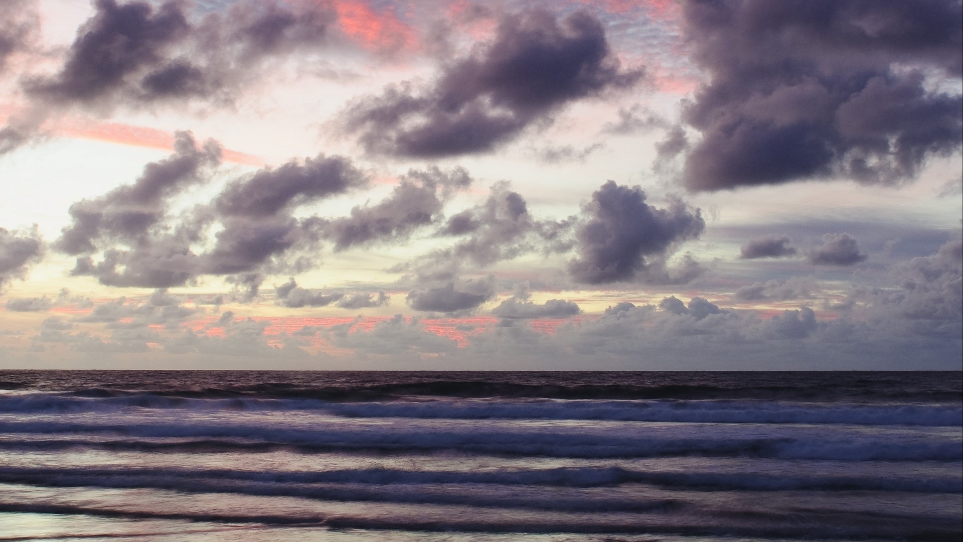 Sunset over the ocean with clouds HD Wallpaper